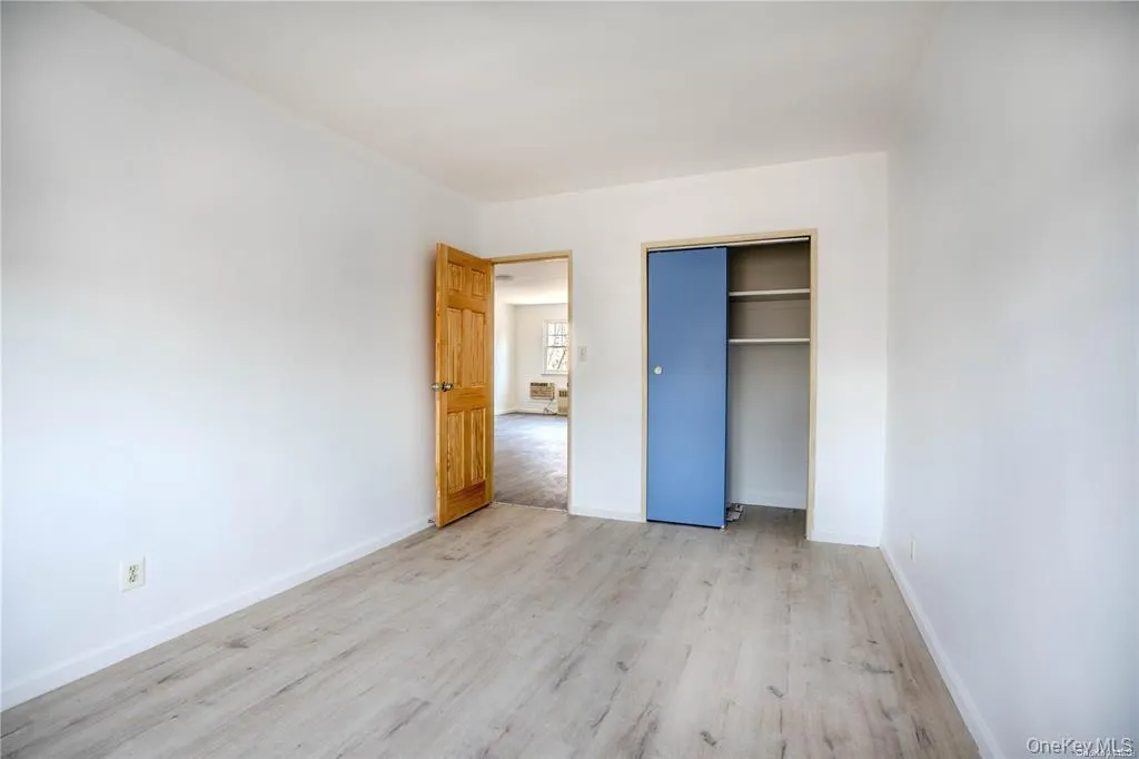 Unfurnished bedroom with light wood-style floors and a closet Unfurnished bedroom with light wood-style floors and a closet