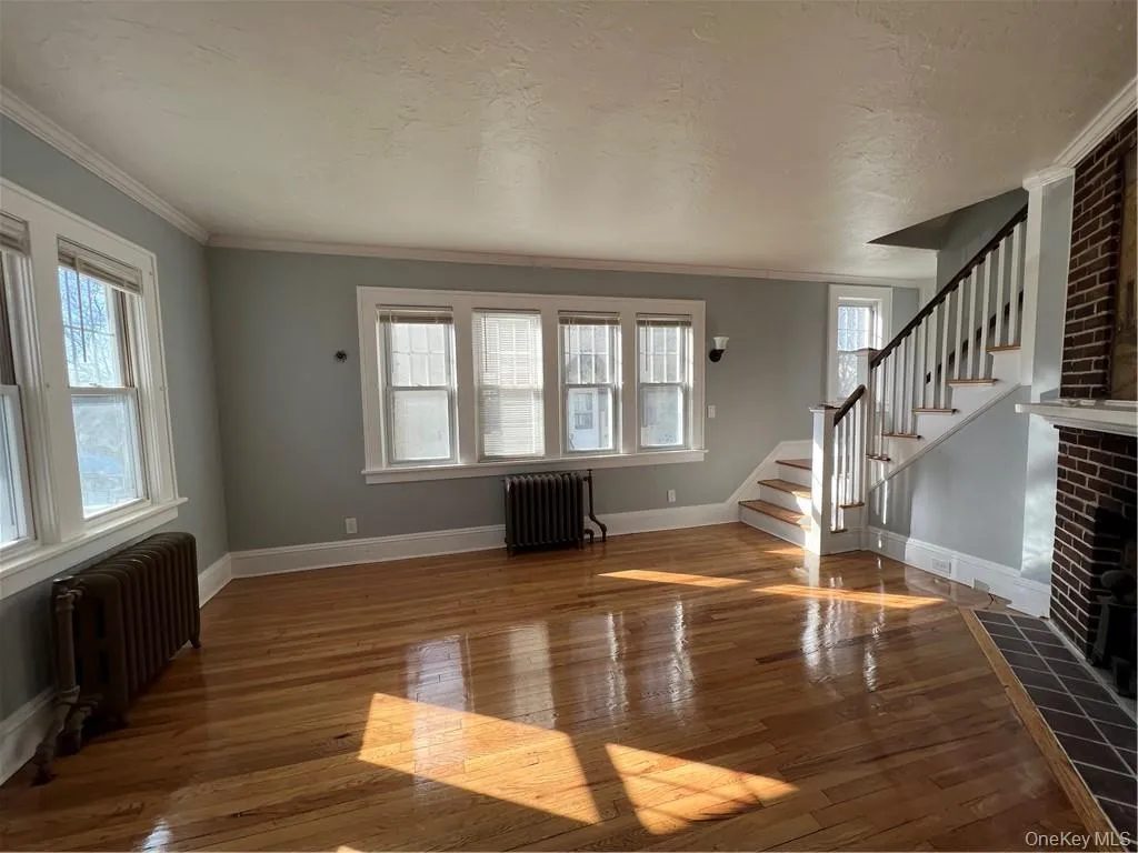 Living Room , refinished hardwood floors with wood burning fireplace Living Room , refinished hardwood floors with wood burning fireplace