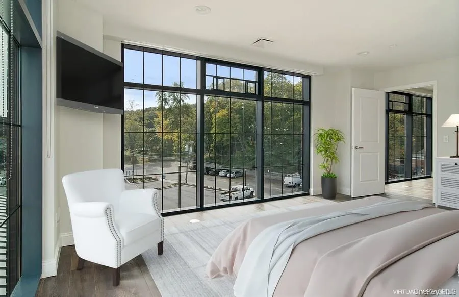Bedroom featuring wood finished floors and recessed lighting Bedroom featuring wood finished floors and recessed lighting