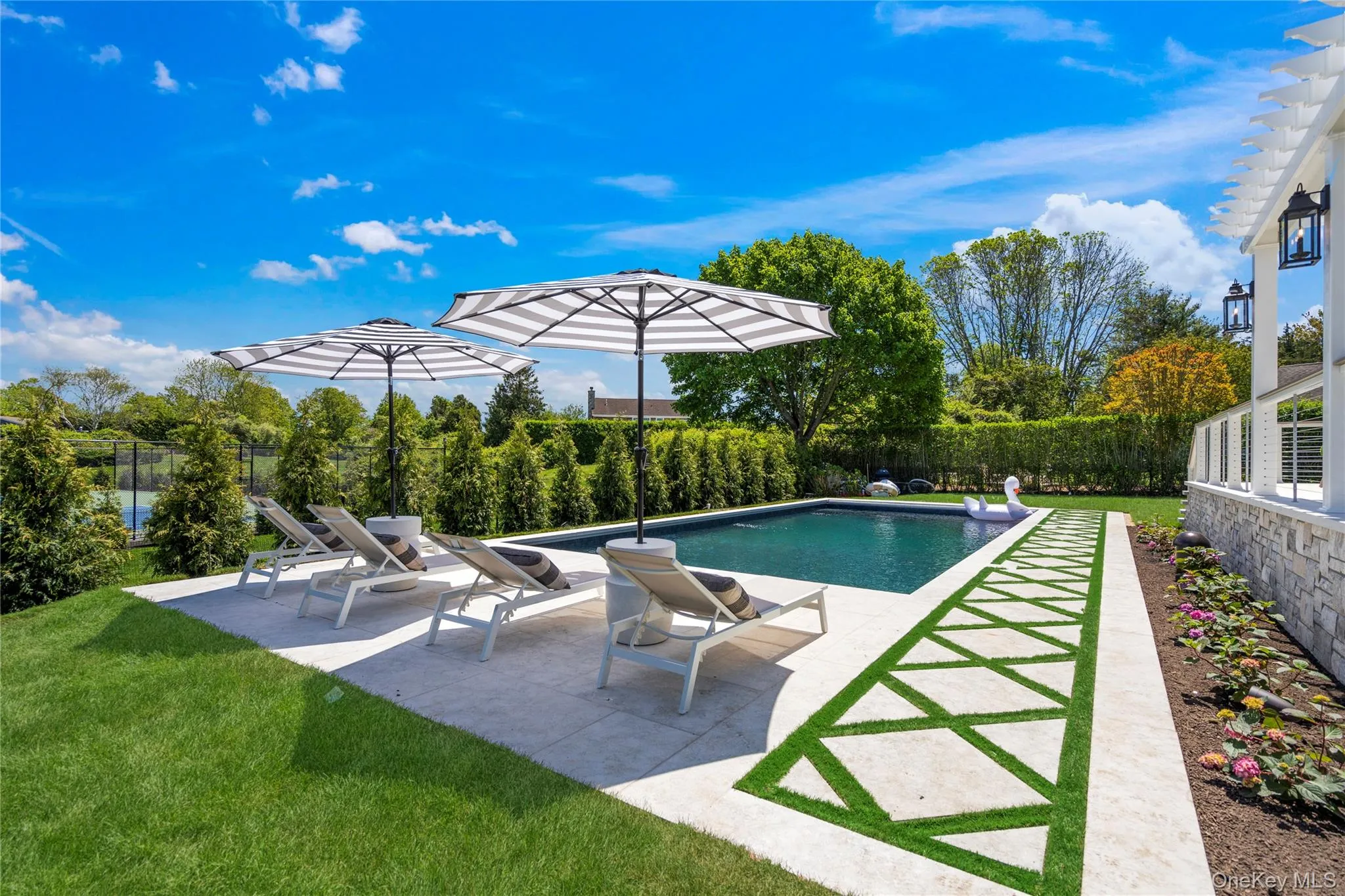 View of swimming pool featuring a fenced backyard and a patio area View of swimming pool featuring a fenced backyard and a patio area