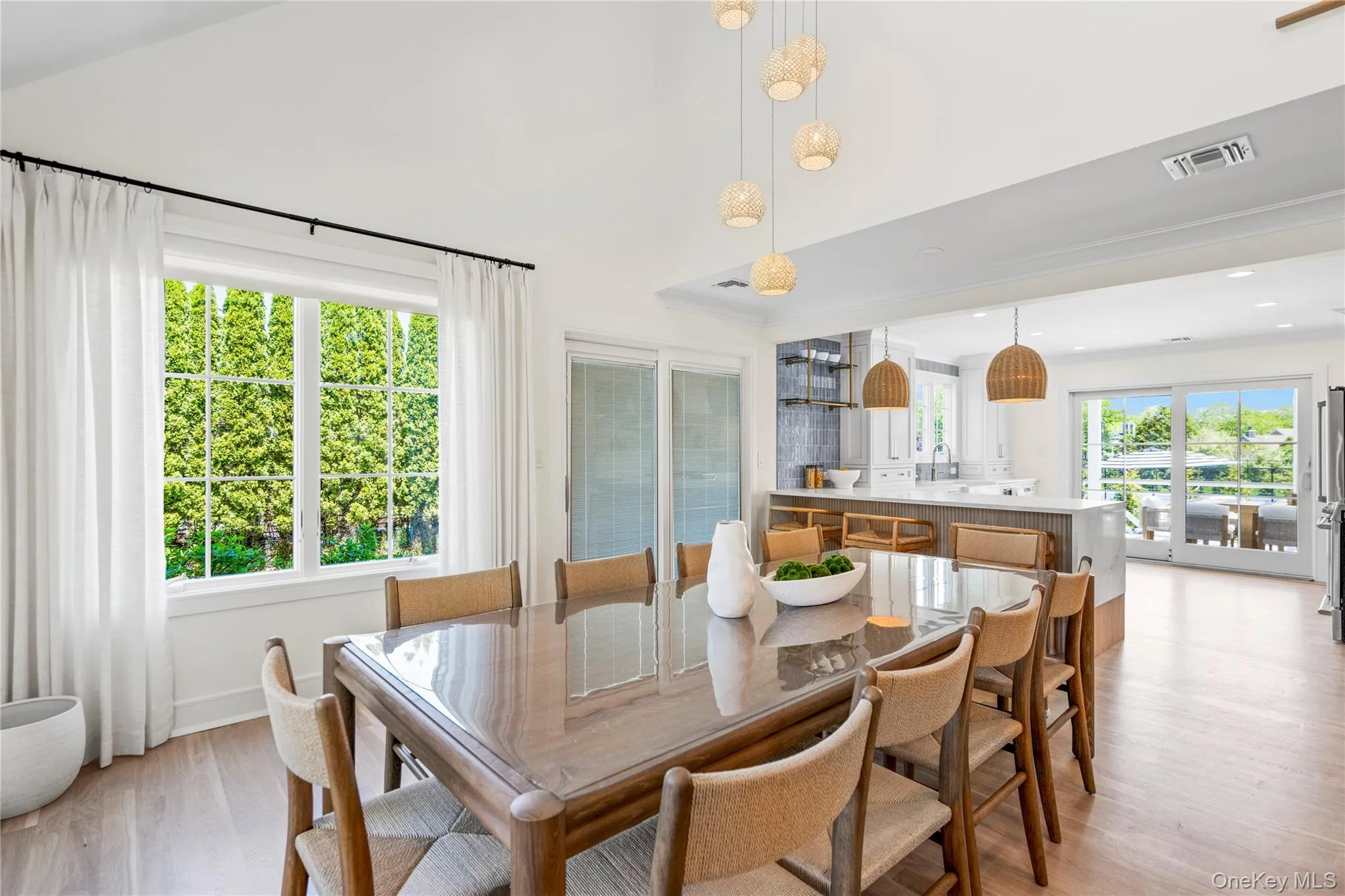 Dining room with light wood-type flooring and baseboards Dining room with light wood-type flooring and baseboards