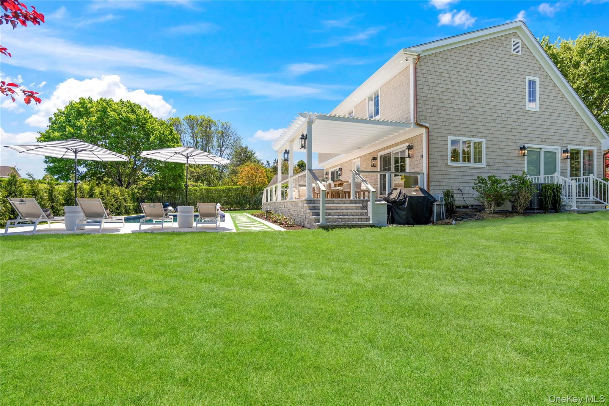 Rear view of house featuring a patio area and a yard Rear view of house featuring a patio area and a yard