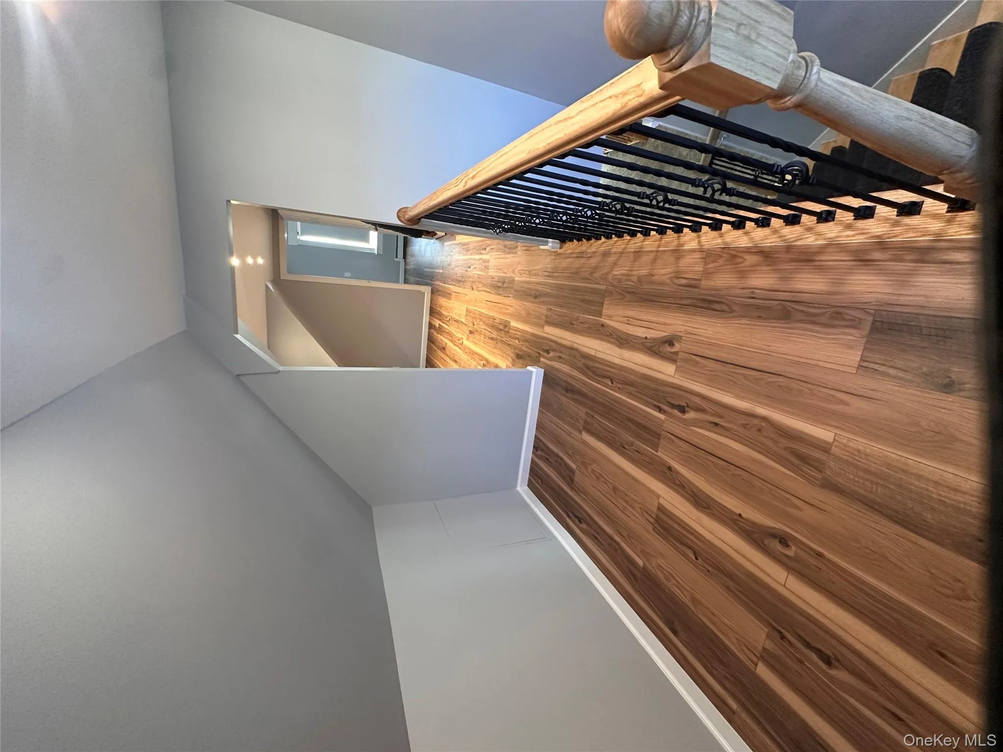 Additional living space featuring wood finished floors and lofted ceiling Additional living space featuring wood finished floors and lofted ceiling