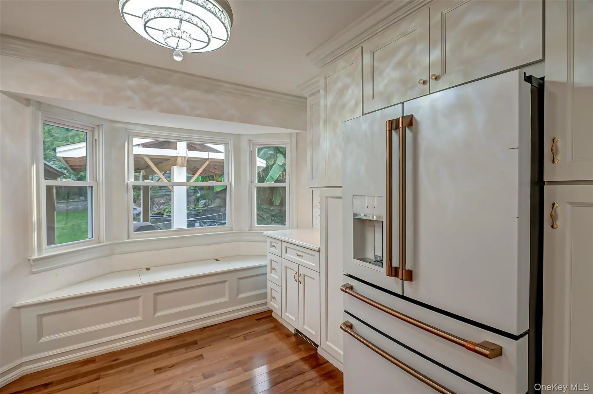 Kitchen with window seat, GE cafe refrigerator, lots of cabinets Kitchen with window seat, GE cafe refrigerator, lots of cabinets