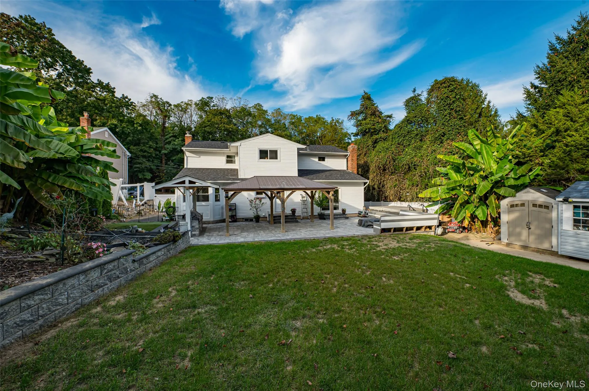 Rear view of property featuring a lawn, a patio, gas bbq, a storage shed, pergola no longer there Rear view of property featuring a lawn, a patio, gas bbq, a storage shed, pergola no longer there