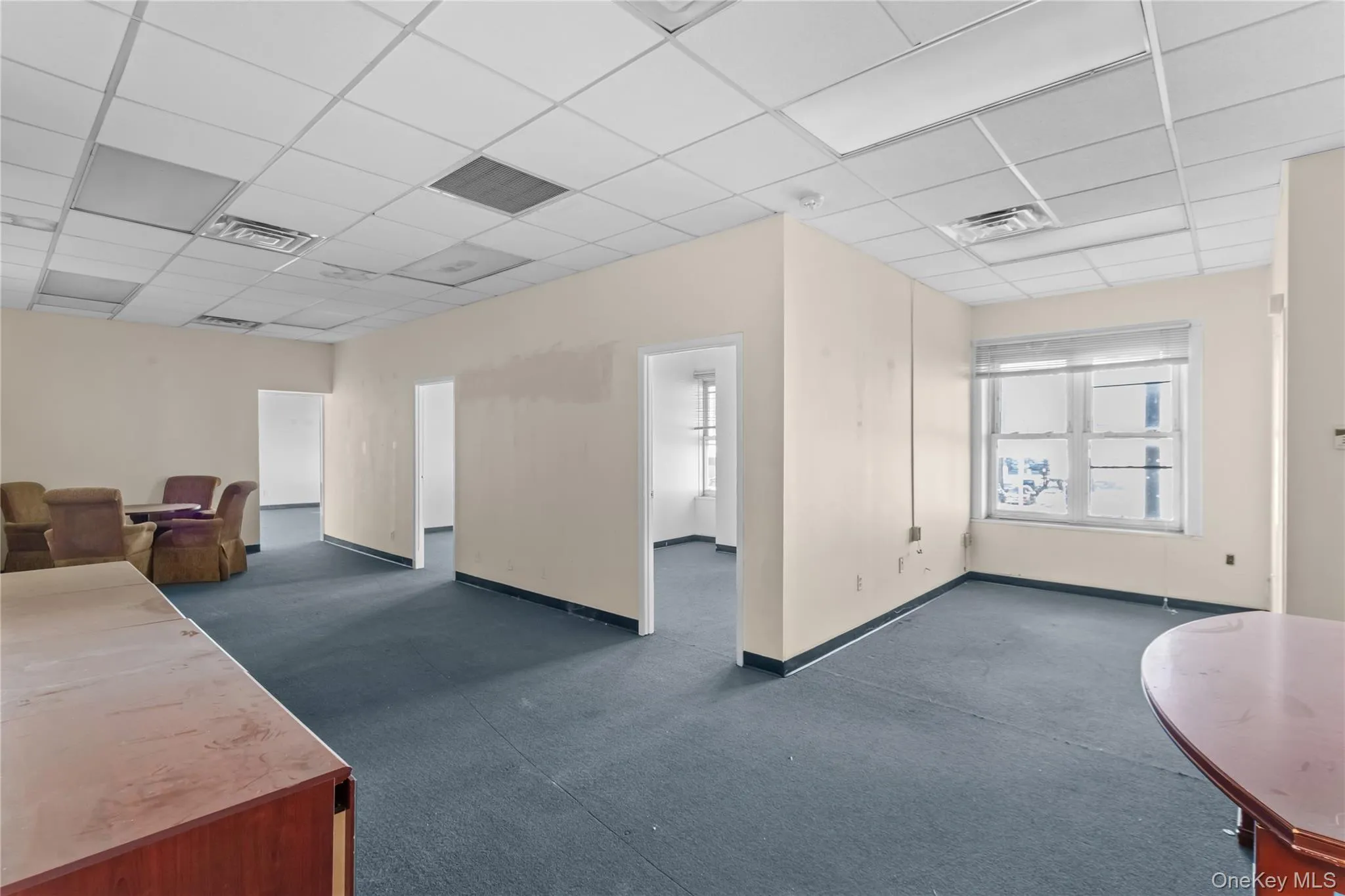 Common area featuring a drop ceiling Common area featuring a drop ceiling