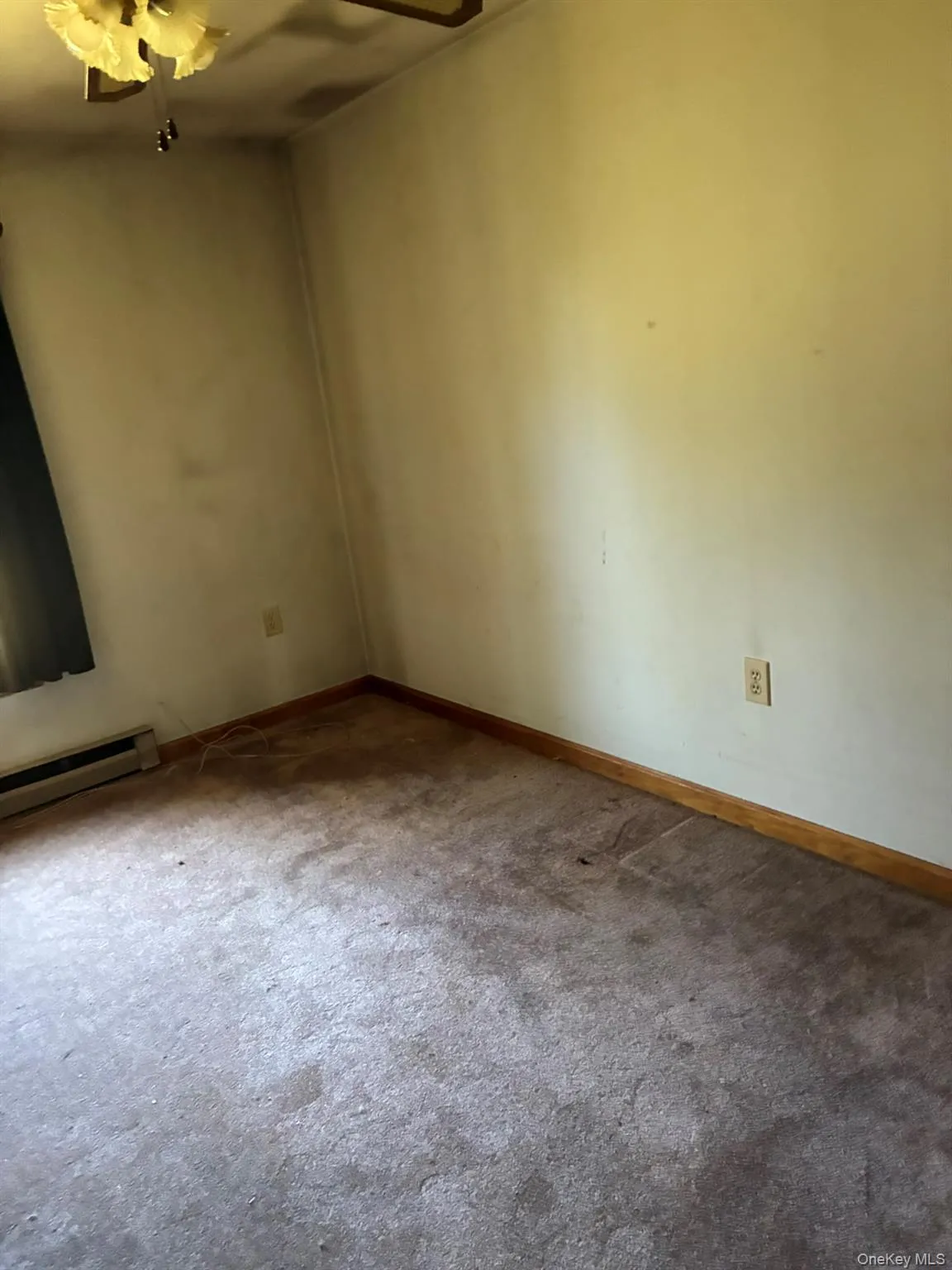 3RD room with carpet flooring and baseboard heating 3RD room with carpet flooring and baseboard heating