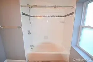 Bathroom with shower / bath combination Bathroom with shower / bath combination