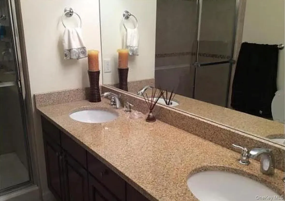 Bathroom with a shower stall and double vanity Bathroom with a shower stall and double vanity