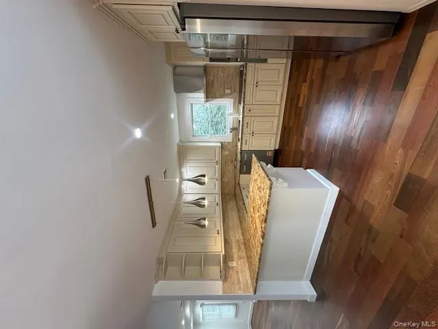 Kitchen featuring pendant lighting, backsplash, a peninsula, refrigerator, and open shelves Kitchen featuring pendant lighting, backsplash, a peninsula, refrigerator, and open shelves