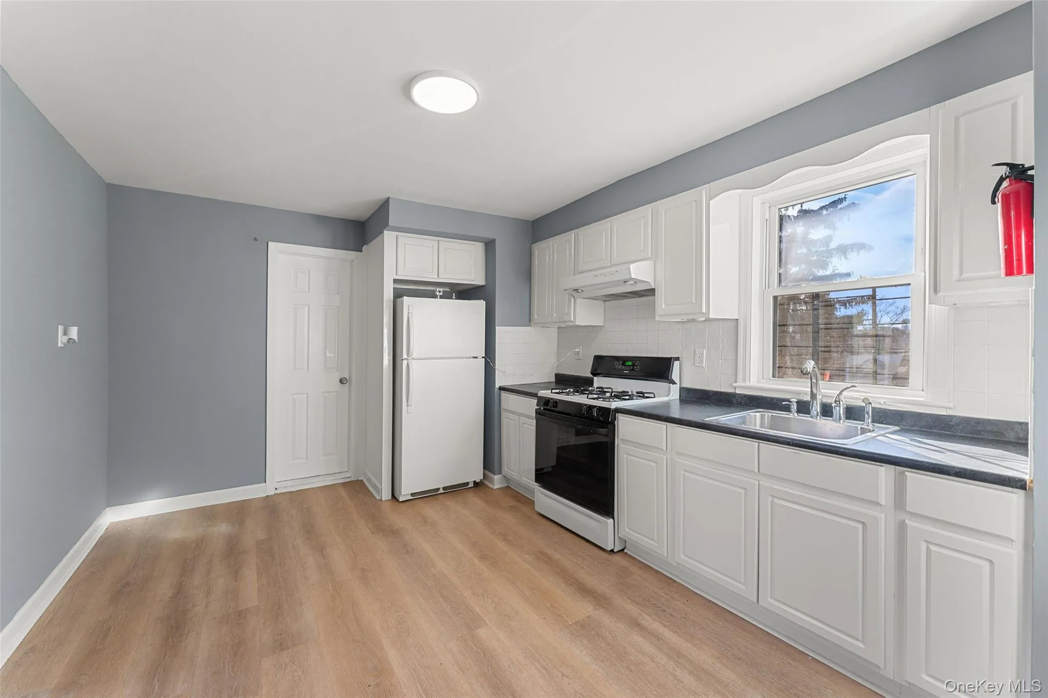 Alternate view of Kitchen showing refrigerator Alternate view of Kitchen showing refrigerator