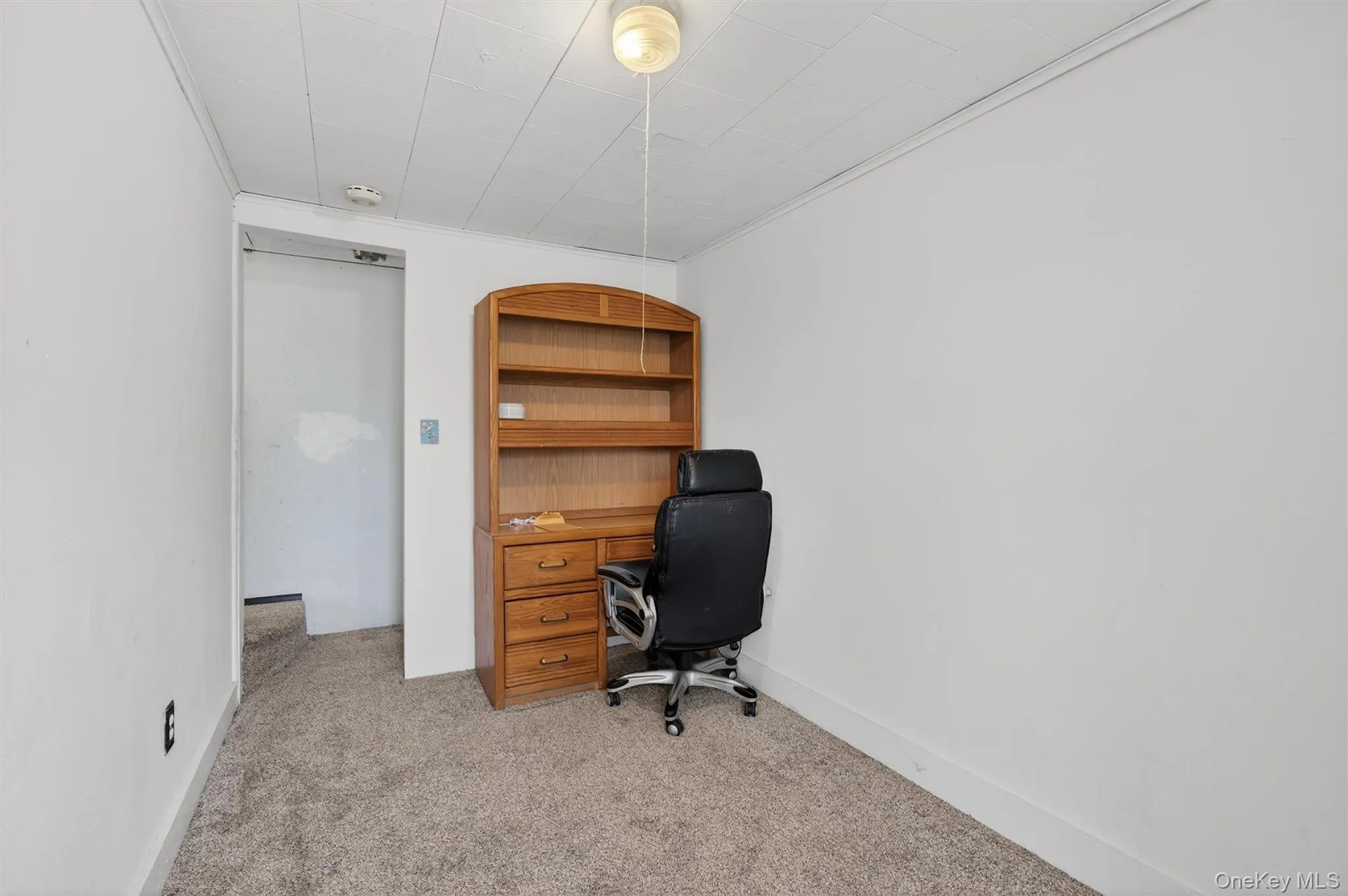 Office area featuring light carpet Office area featuring light carpet