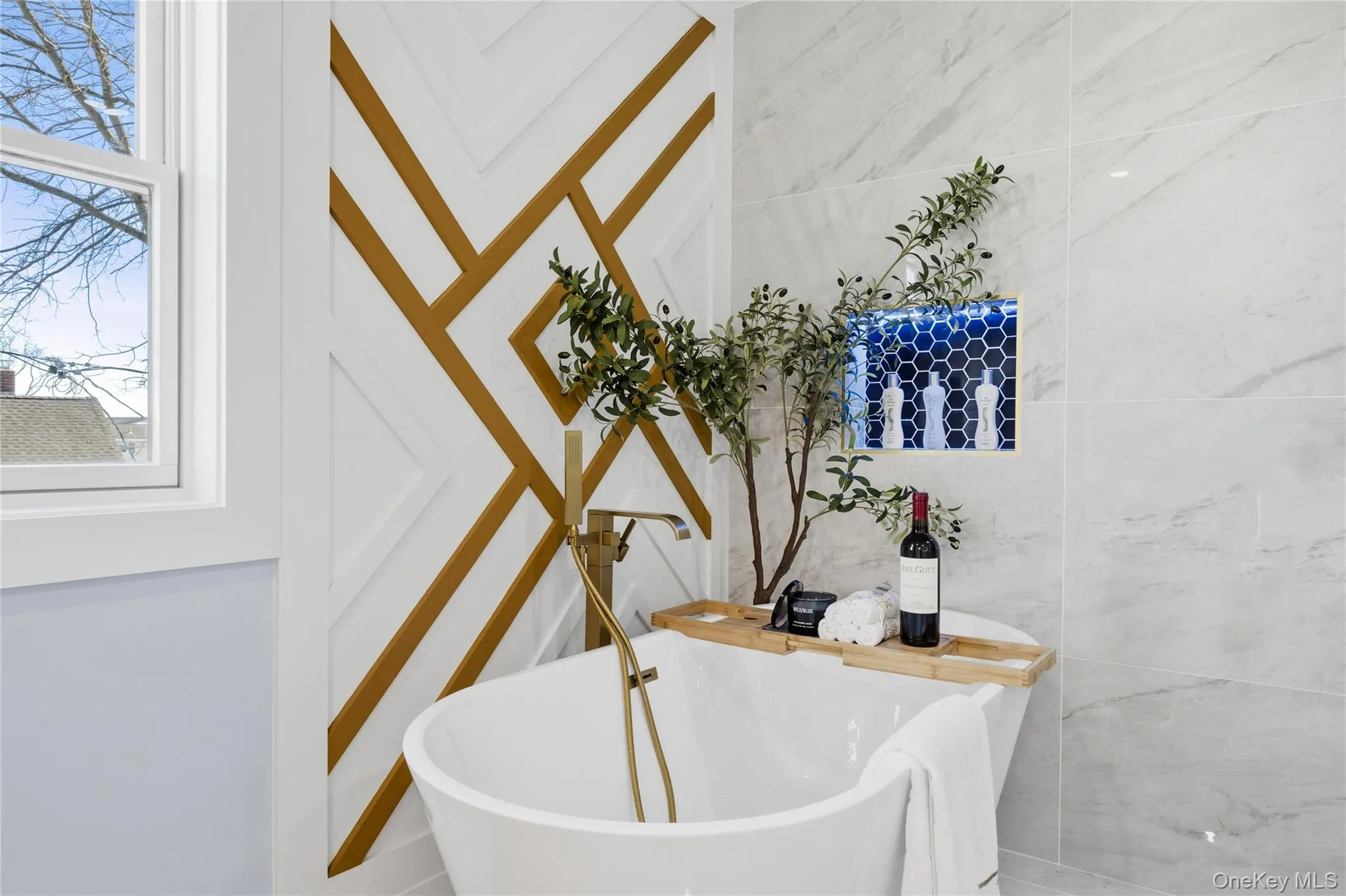 Full bathroom featuring a freestanding bath Full bathroom featuring a freestanding bath