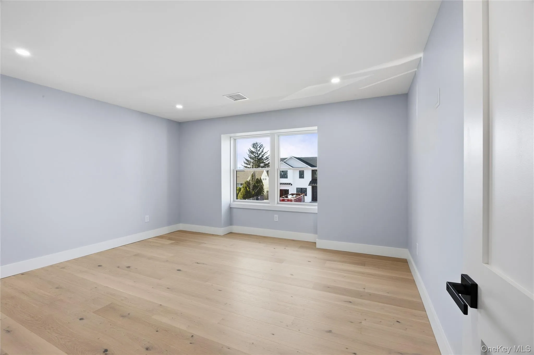Unfurnished room featuring light wood-type flooring and recessed lighting Unfurnished room featuring light wood-type flooring and recessed lighting