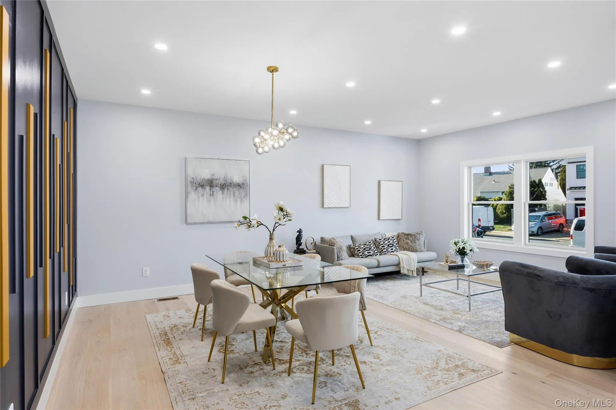Dining room featuring recessed lighting, light wood finished floors, and a chandelier Dining room featuring recessed lighting, light wood finished floors, and a chandelier