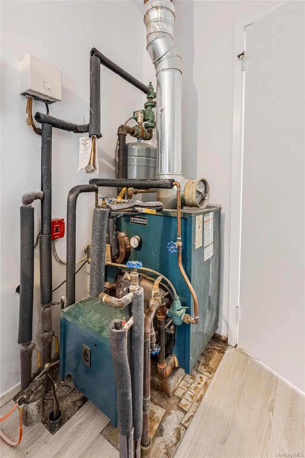 Utility room featuring a heating unit Utility room featuring a heating unit