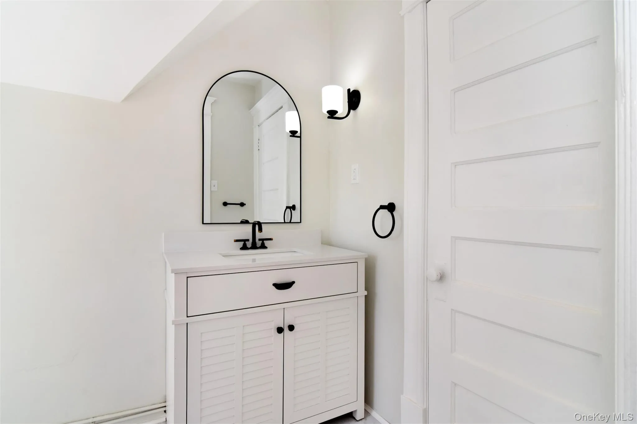 Charming powder room with new fixtures. Charming powder room with new fixtures.