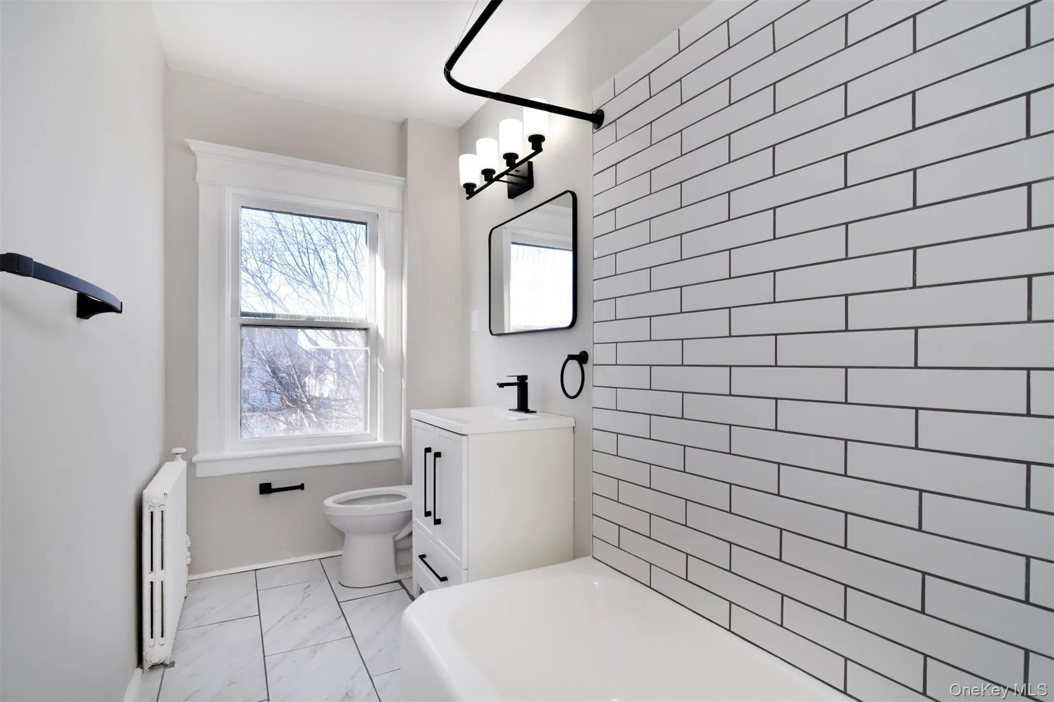 Renovated Hall Bath - new fixtures, custom tile, new flooring. Renovated Hall Bath - new fixtures, custom tile, new flooring.