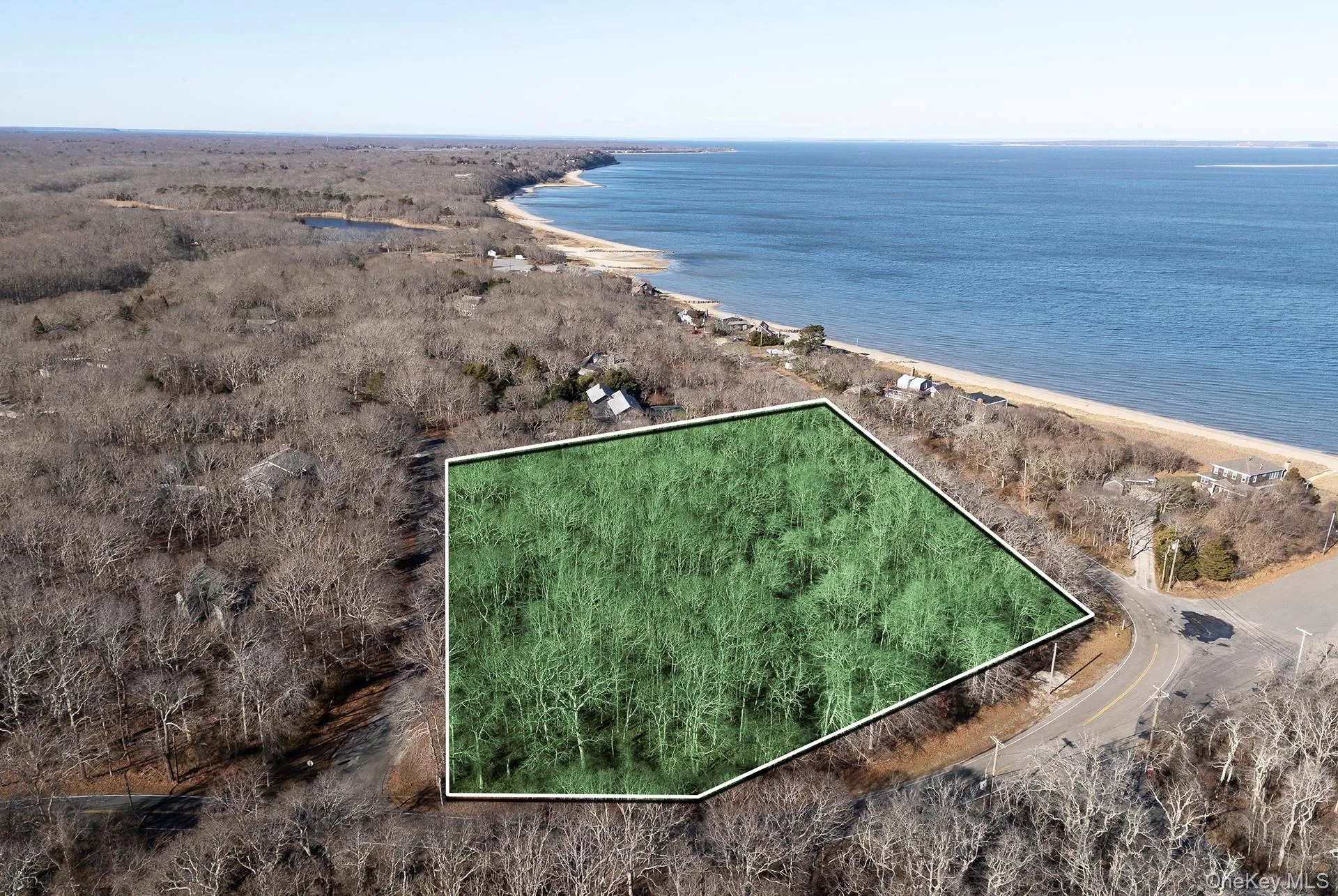 View of property location with property parcel outlined and expansive coastline