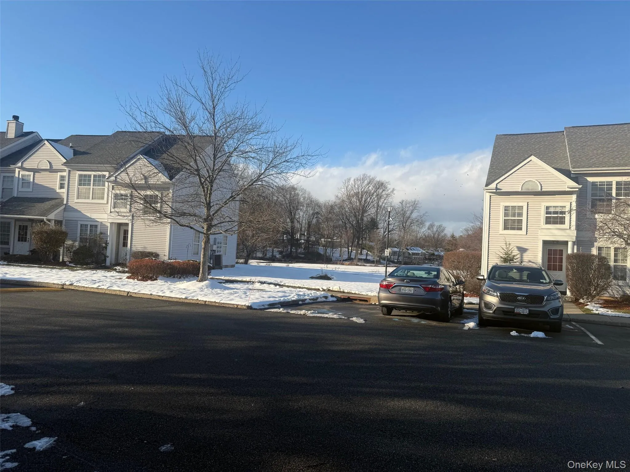 View of asphalt road featuring a residential view View of asphalt road featuring a residential view