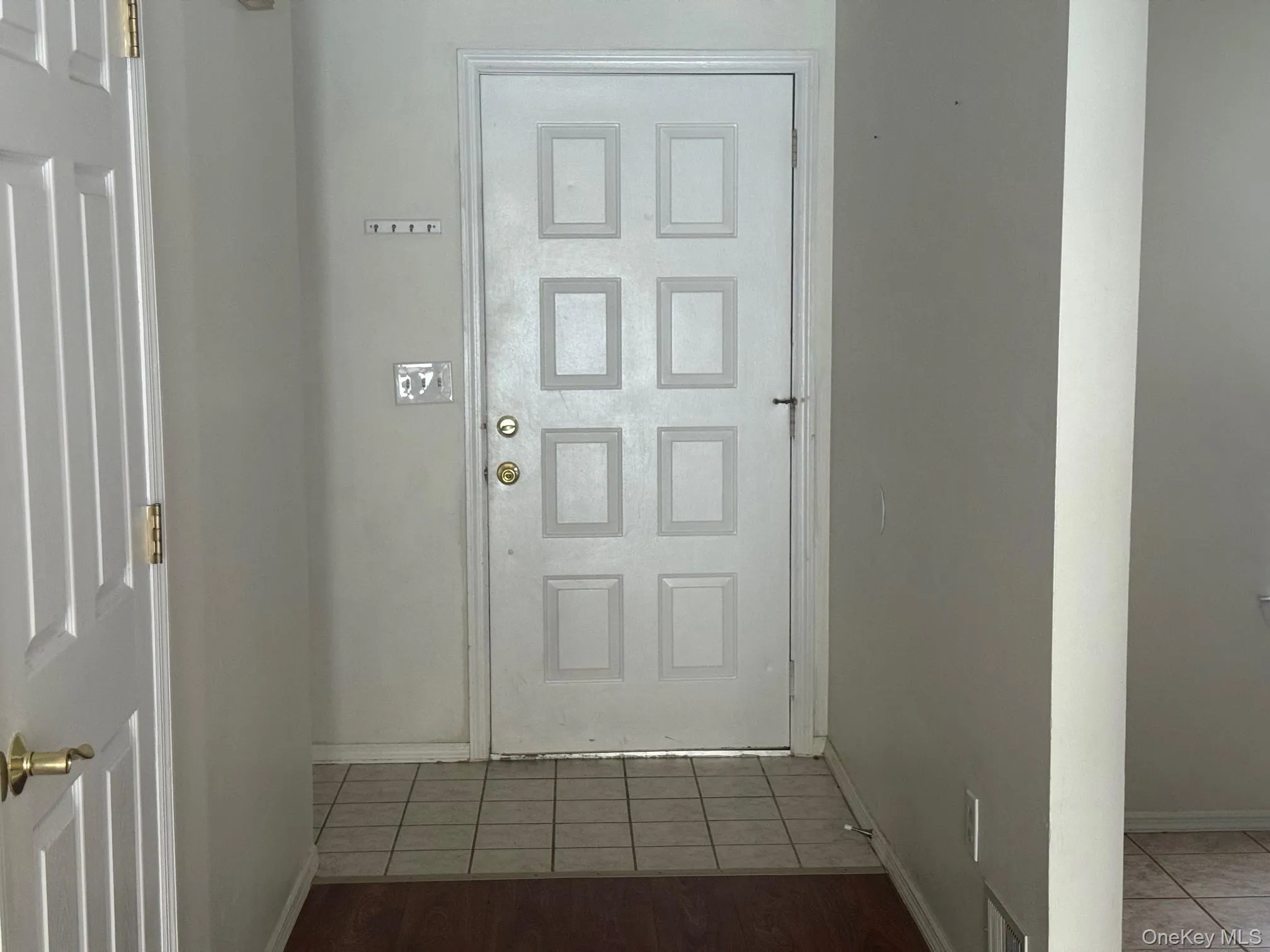 Entryway with baseboards and tile patterned floors Entryway with baseboards and tile patterned floors