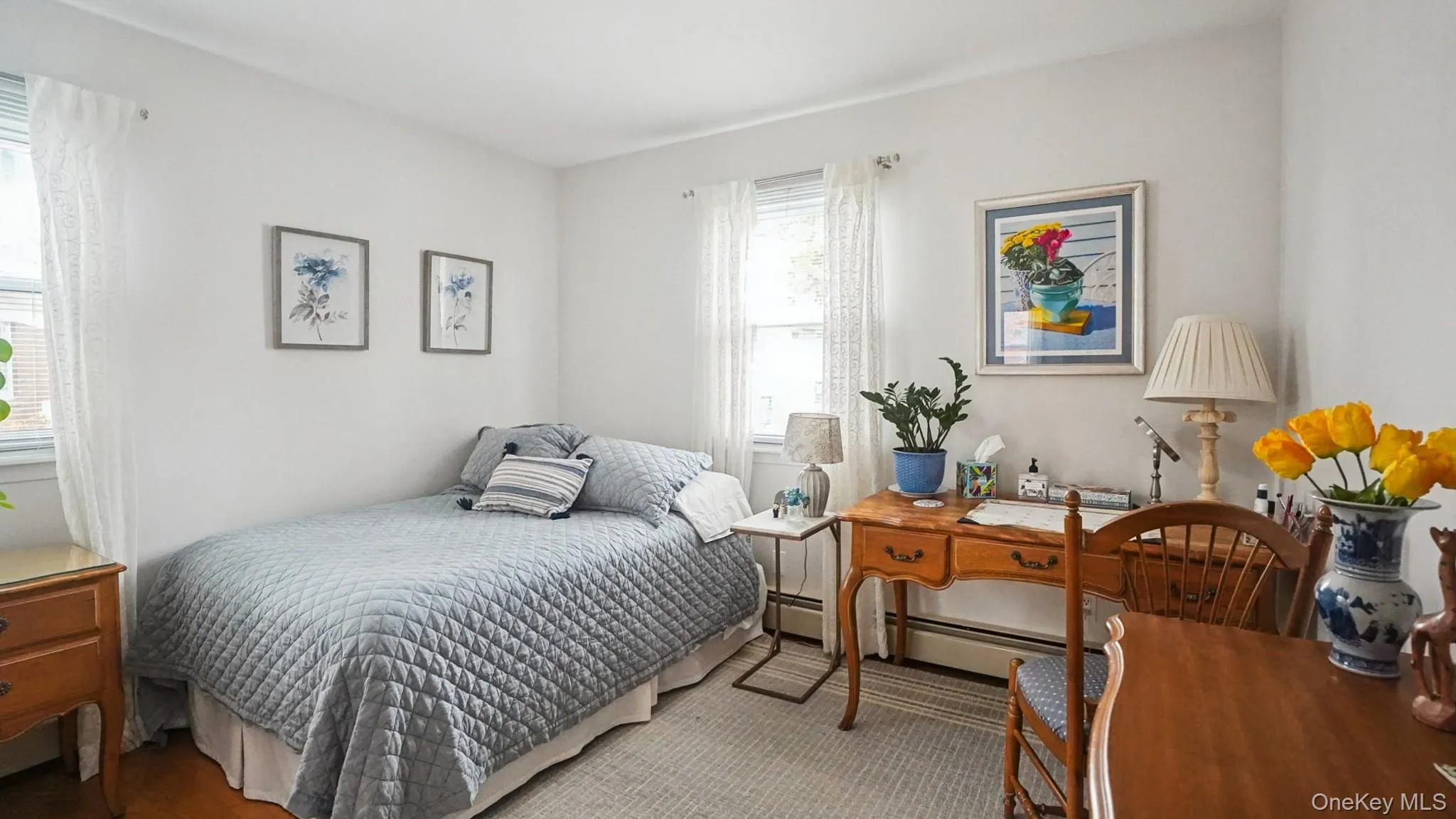 Bedroom with a baseboard heating unit Bedroom with a baseboard heating unit