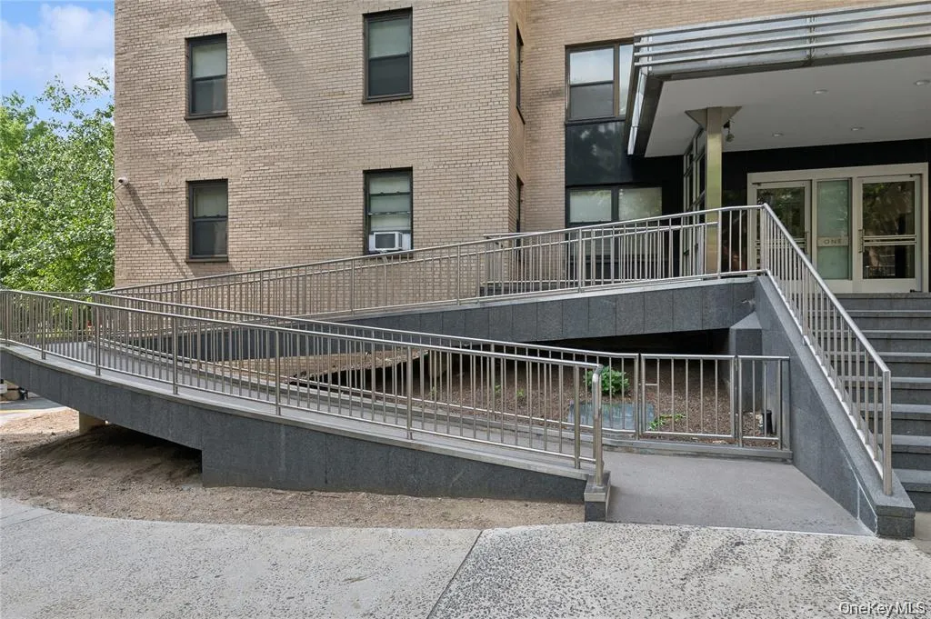 View of property's community featuring a balcony View of property's community featuring a balcony