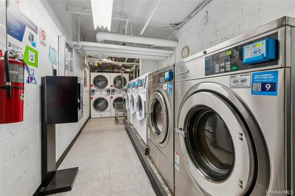 Shared laundry featuring estacked washer and dryer Shared laundry featuring estacked washer and dryer