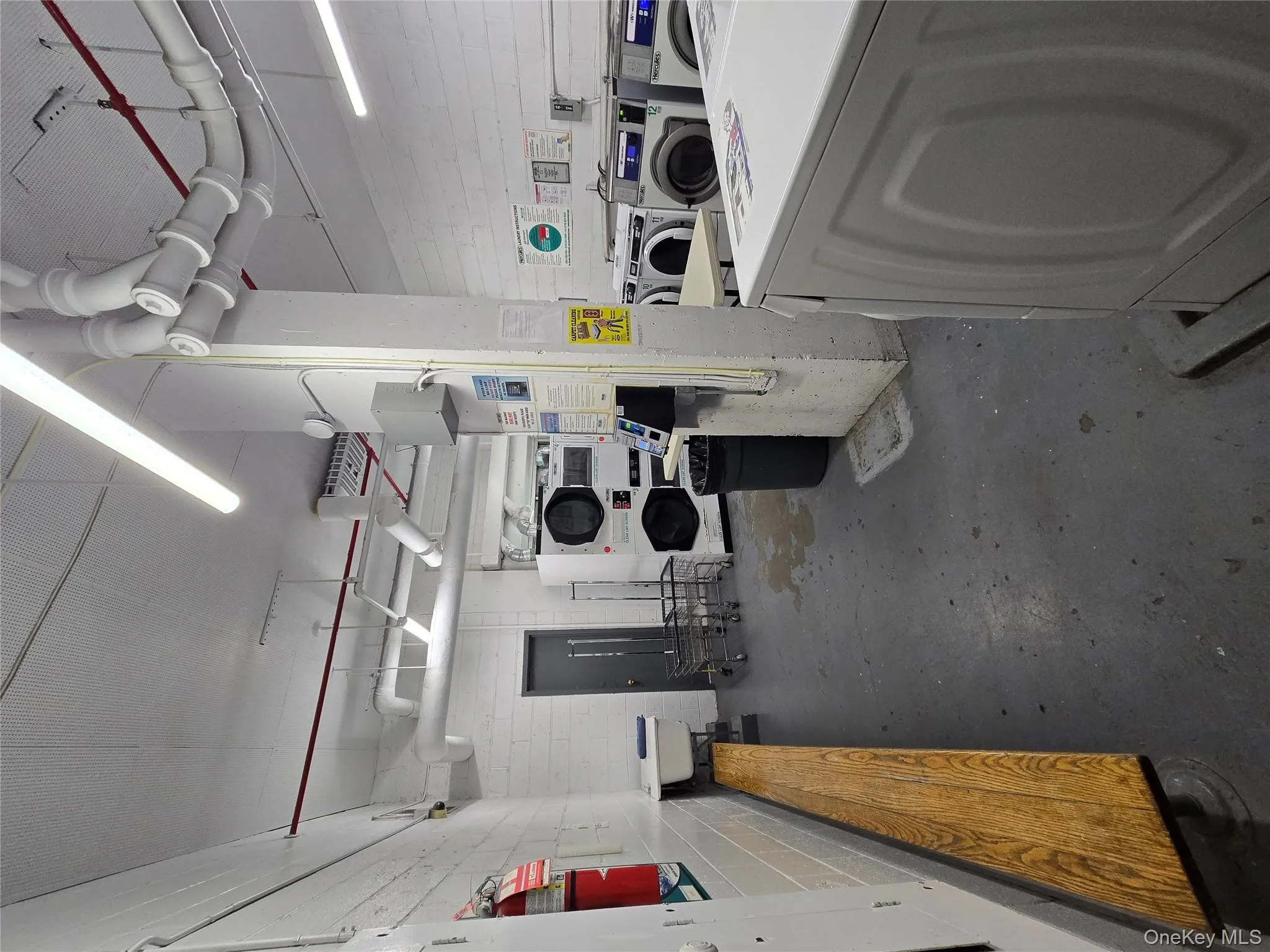 Miscellaneous room with estacked washer and dryer Miscellaneous room with estacked washer and dryer