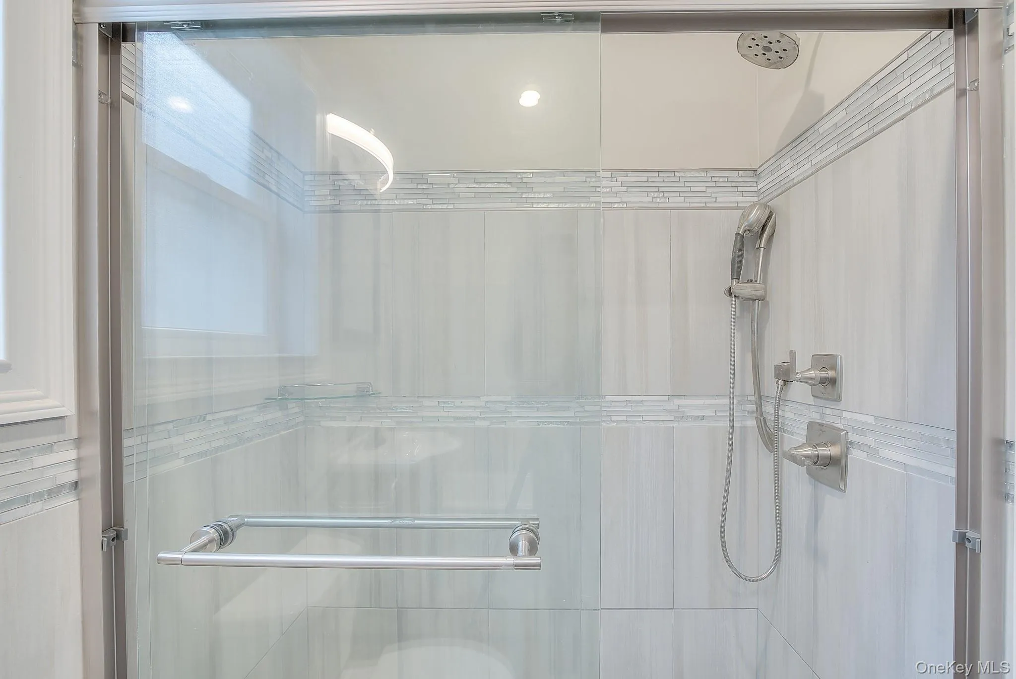 Bathroom with a shower stall Bathroom with a shower stall