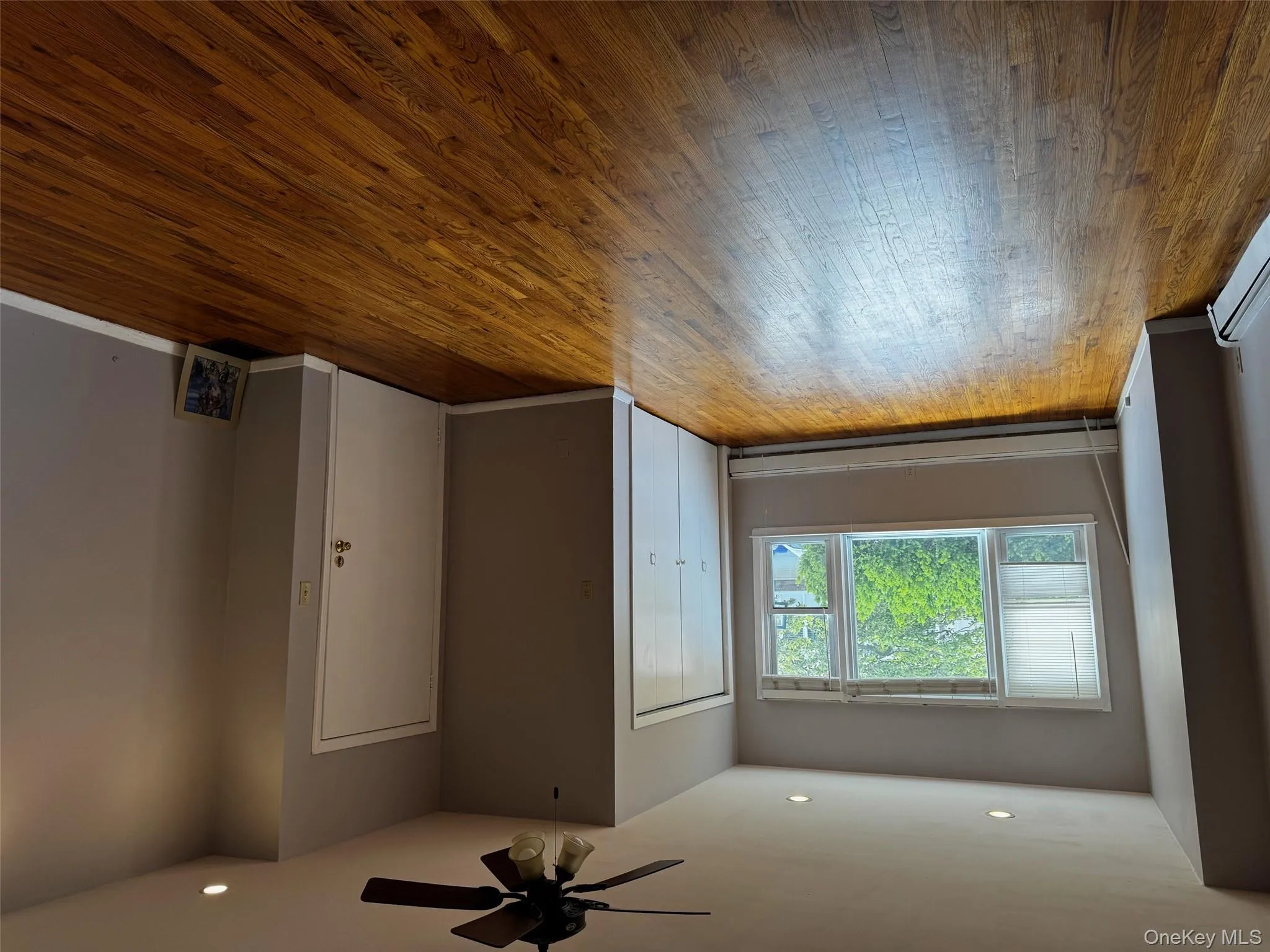 Unfurnished bedroom featuring recessed lighting, a baseboard heating unit, hardwood / wood-style floors, a ceiling fan, and a closet Unfurnished bedroom featuring recessed lighting, a baseboard heating unit, hardwood / wood-style floors, a ceiling fan, and a closet