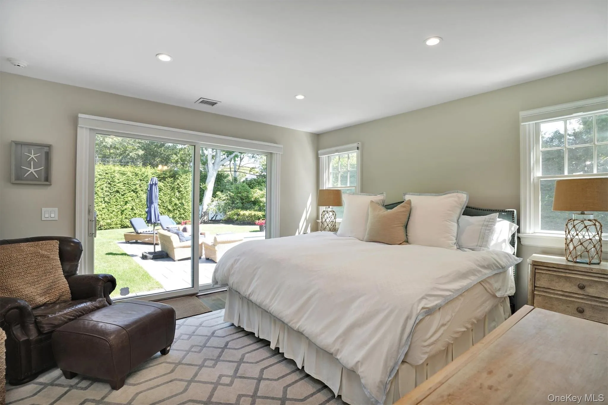 Bedroom with access to outside, multiple windows, and recessed lighting Bedroom with access to outside, multiple windows, and recessed lighting