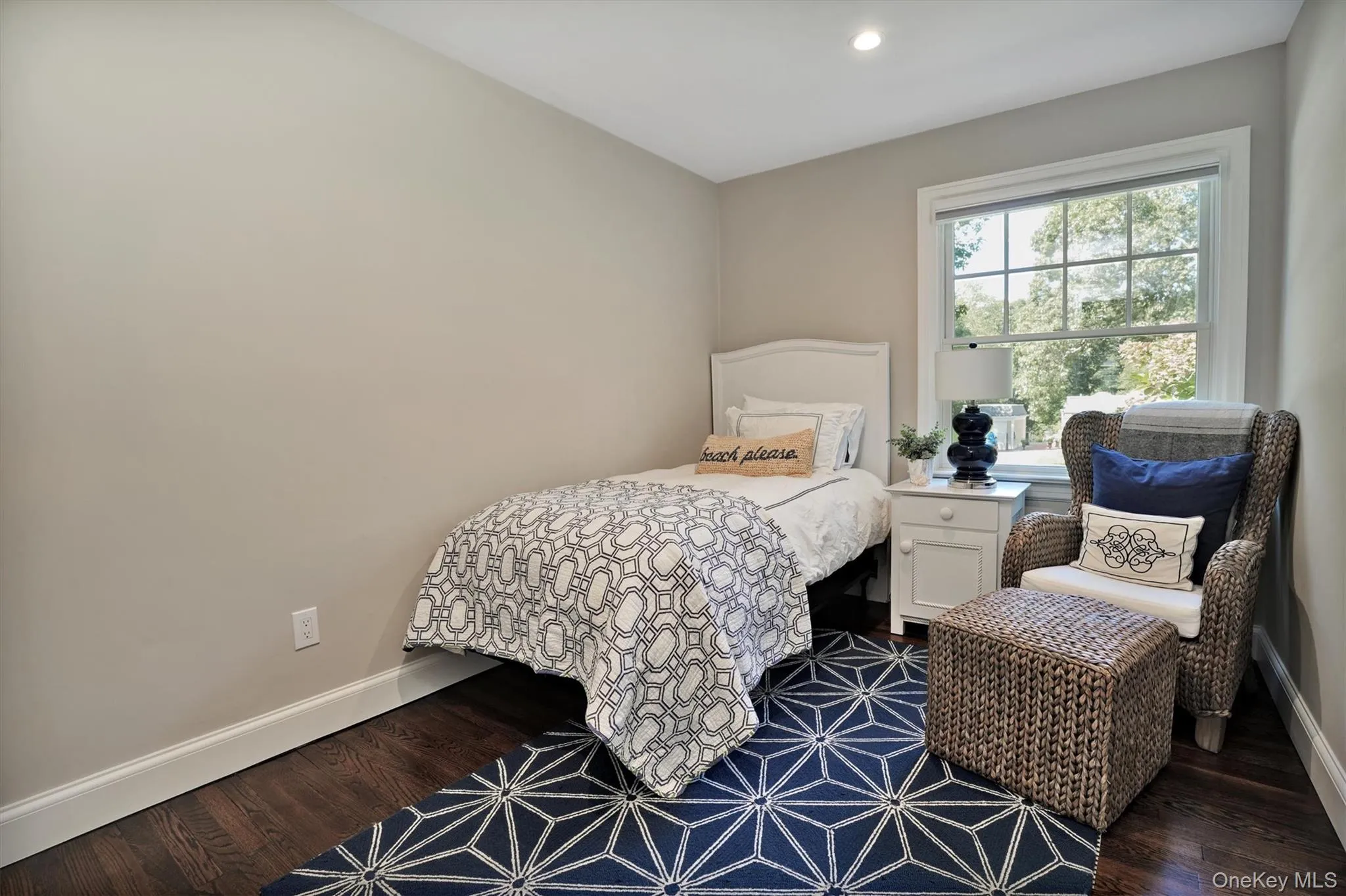 Bedroom with dark wood-style flooring and recessed lighting Bedroom with dark wood-style flooring and recessed lighting