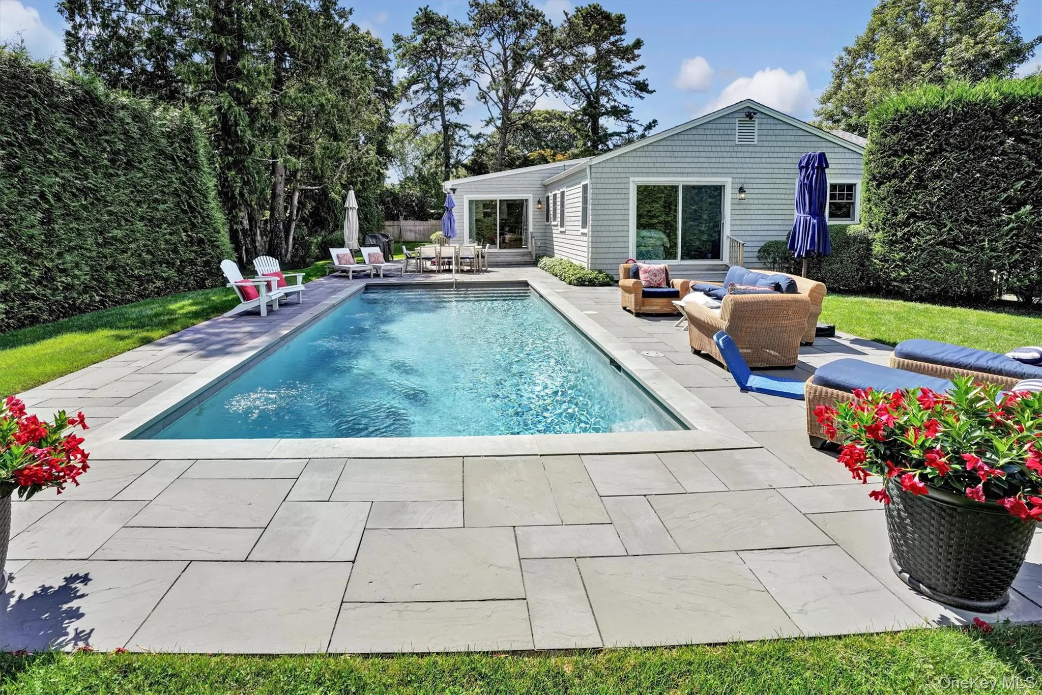 View of pool featuring an outdoor hangout area and a patio area View of pool featuring an outdoor hangout area and a patio area