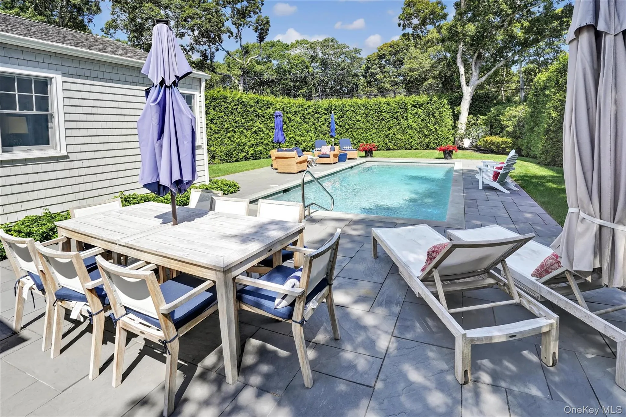 View of swimming pool with a patio, outdoor dining space, and a fenced backyard View of swimming pool with a patio, outdoor dining space, and a fenced backyard