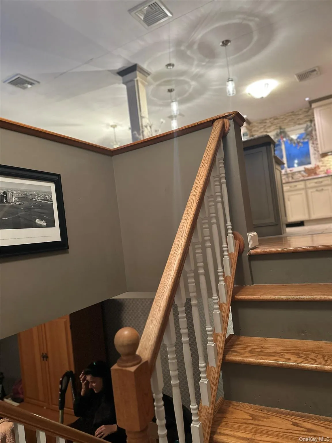 Stairs featuring wood finished floors Stairs featuring wood finished floors