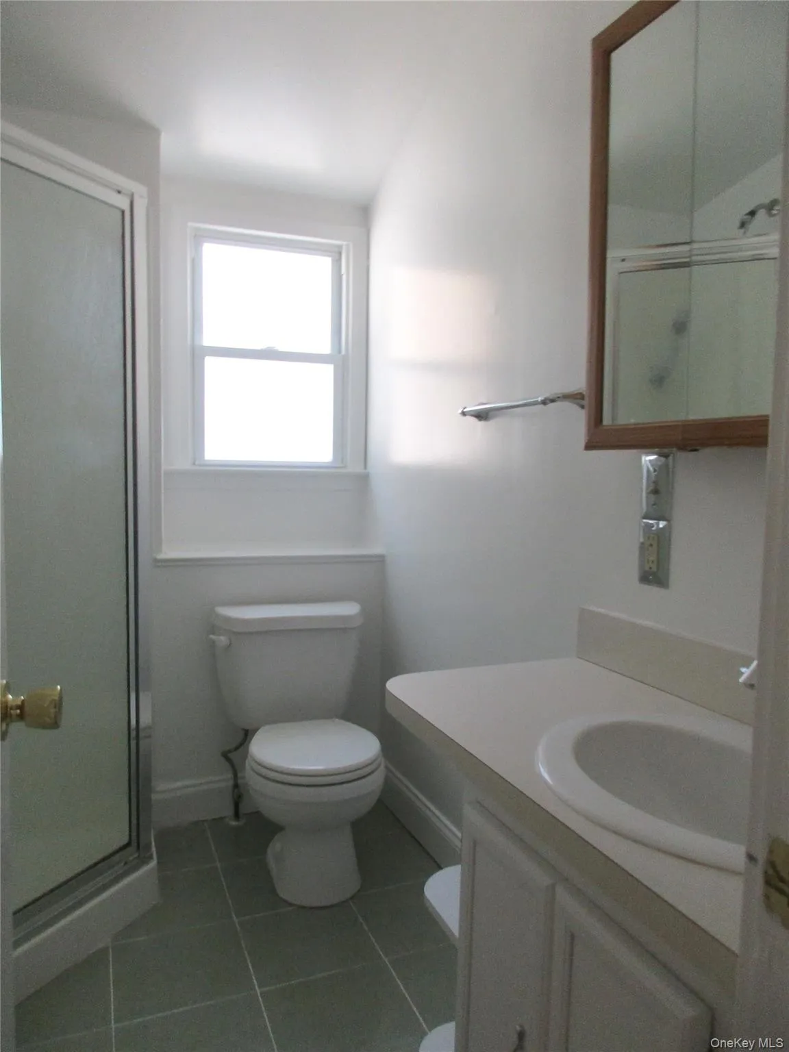 Full bathroom with a walk-in shower, tile patterned flooring, and vanity Full bathroom with a walk-in shower, tile patterned flooring, and vanity
