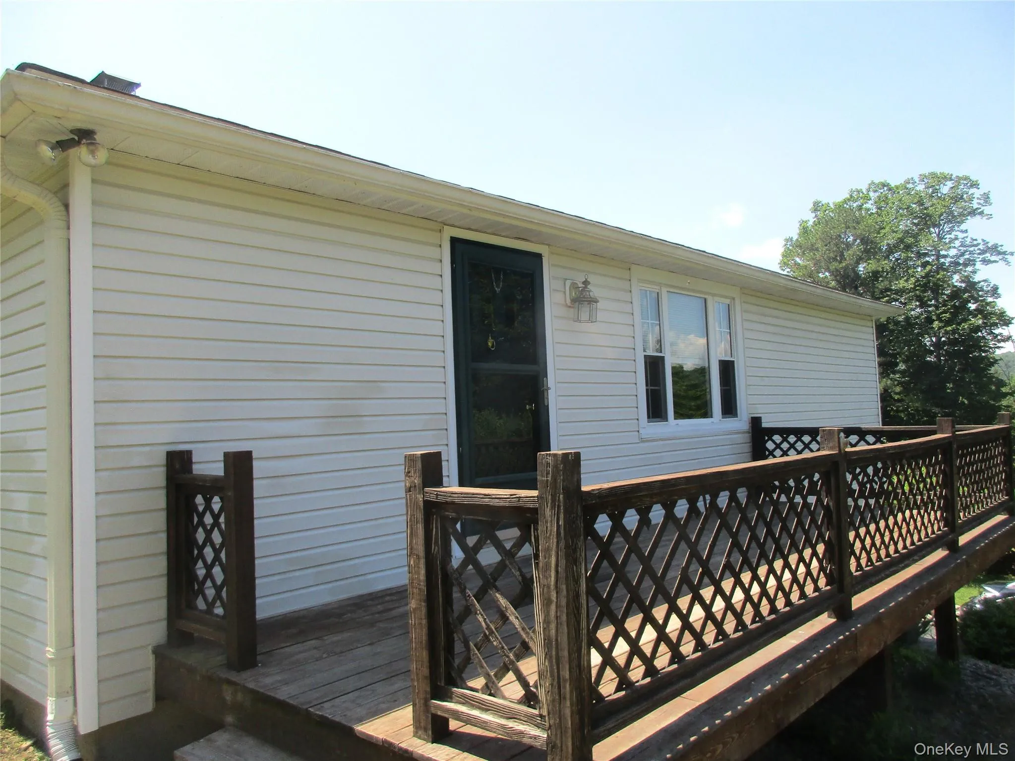 long deck on side with entrance from home. long deck on side with entrance from home.