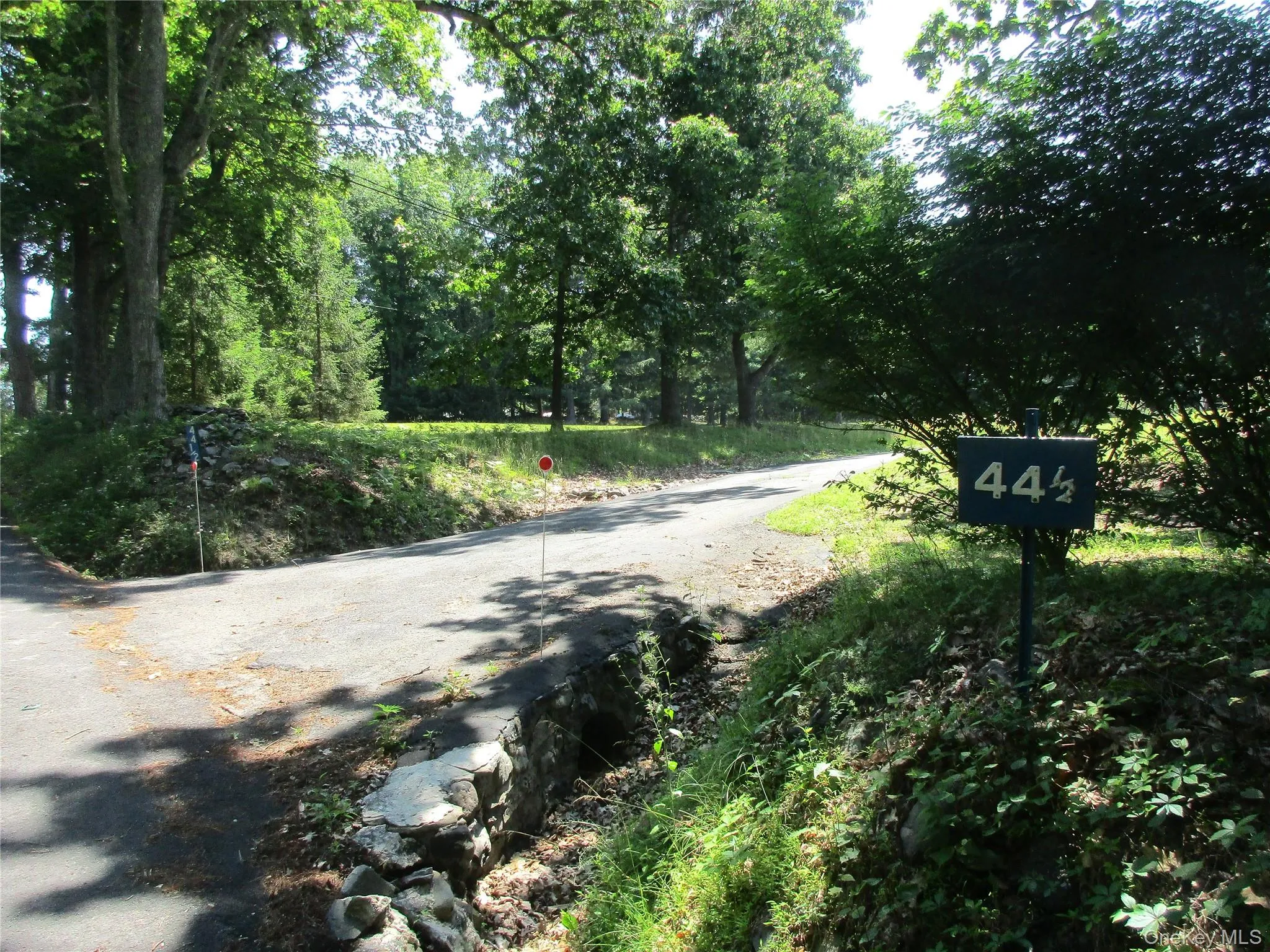 Entry to private driveway number on sign. Entry to private driveway number on sign.
