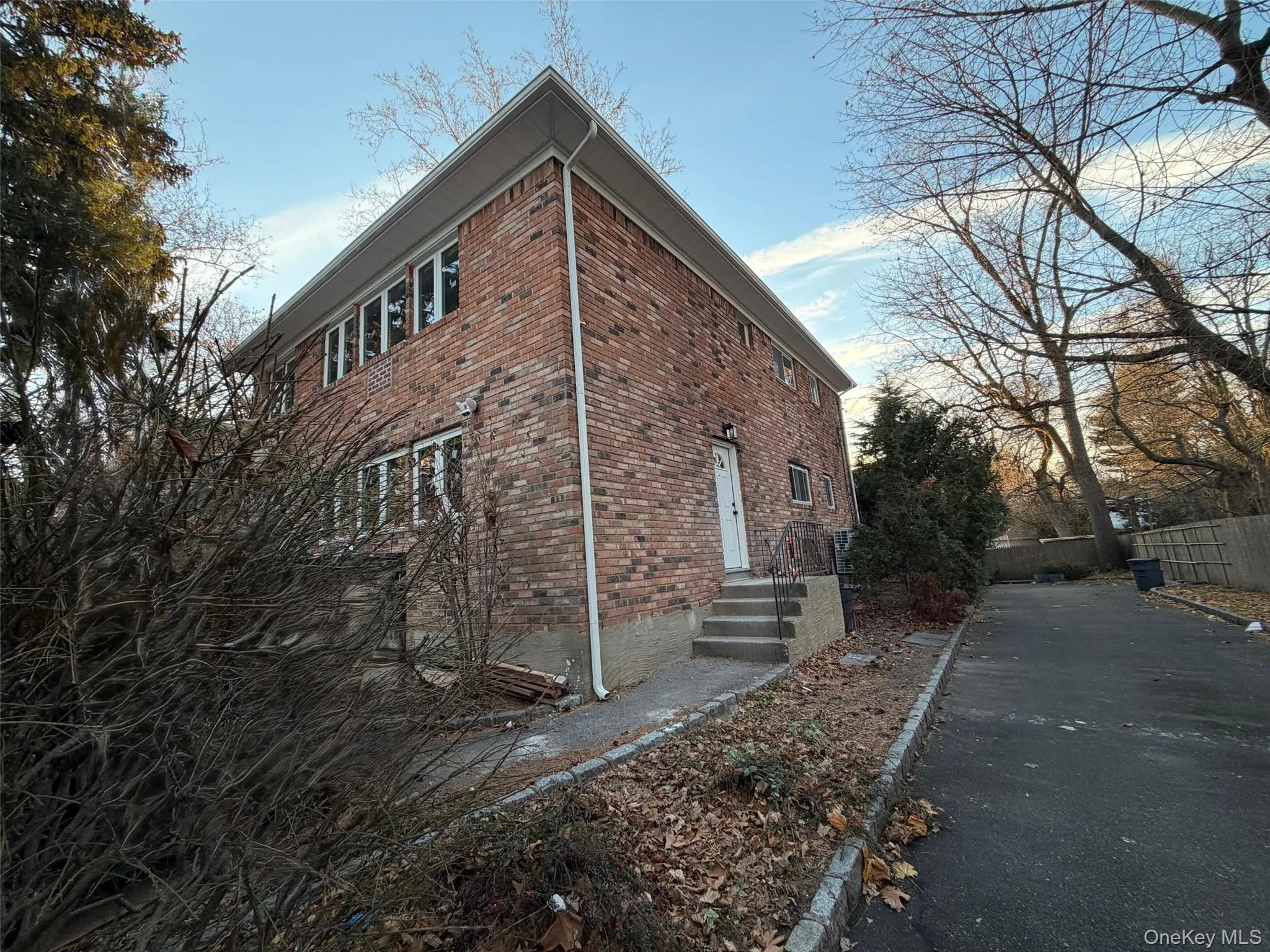 View of side of property with brick siding View of side of property with brick siding