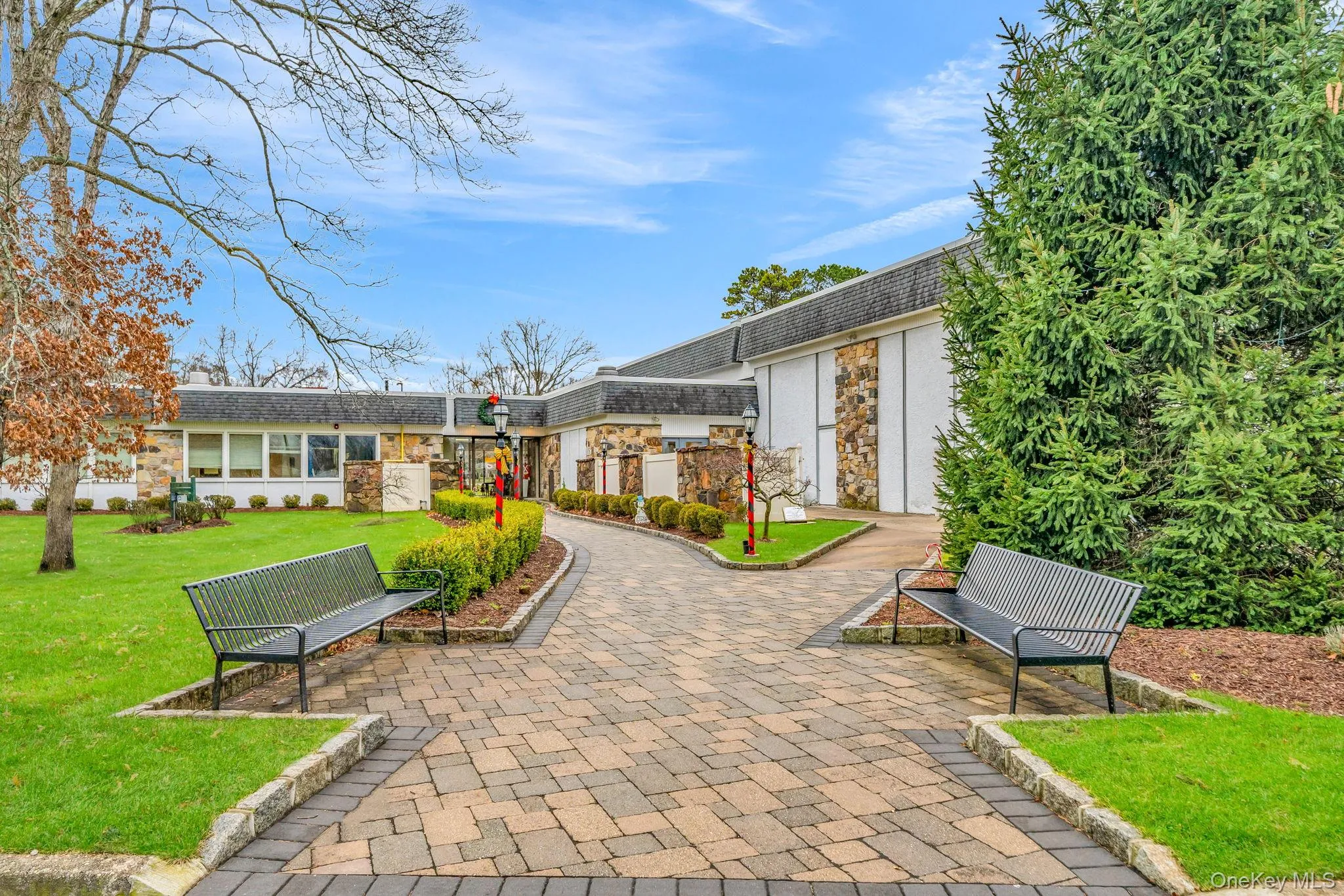 View of property's community featuring a yard View of property's community featuring a yard