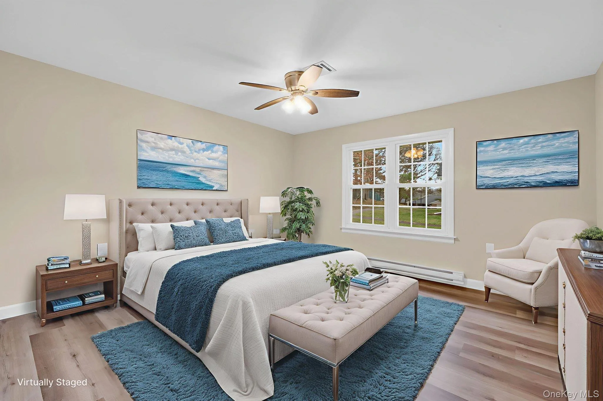 Bedroom with baseboard heating, wood finished floors, and ceiling fan Bedroom with baseboard heating, wood finished floors, and ceiling fan