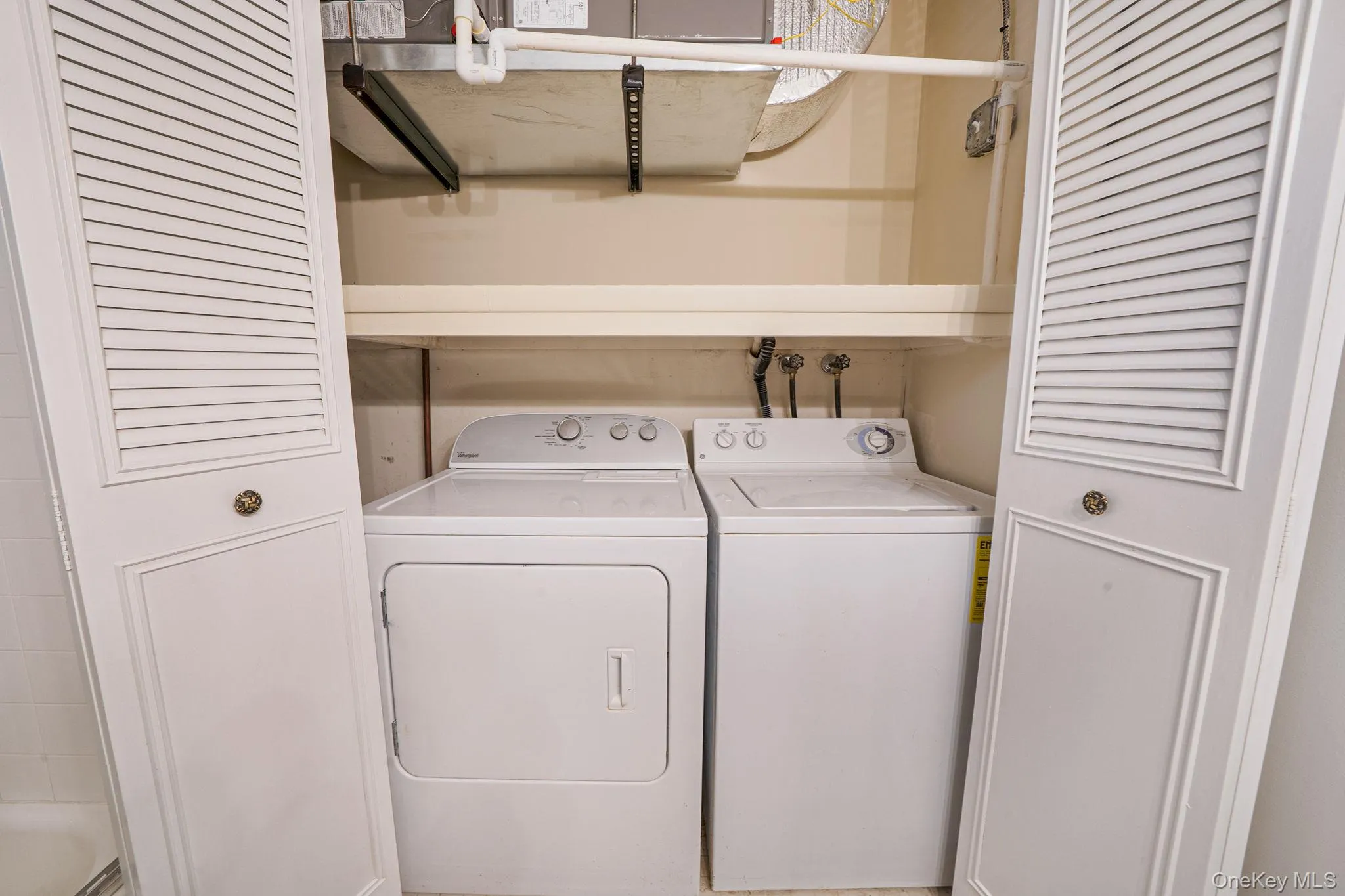 Laundry area with washing machine and dryer Laundry area with washing machine and dryer