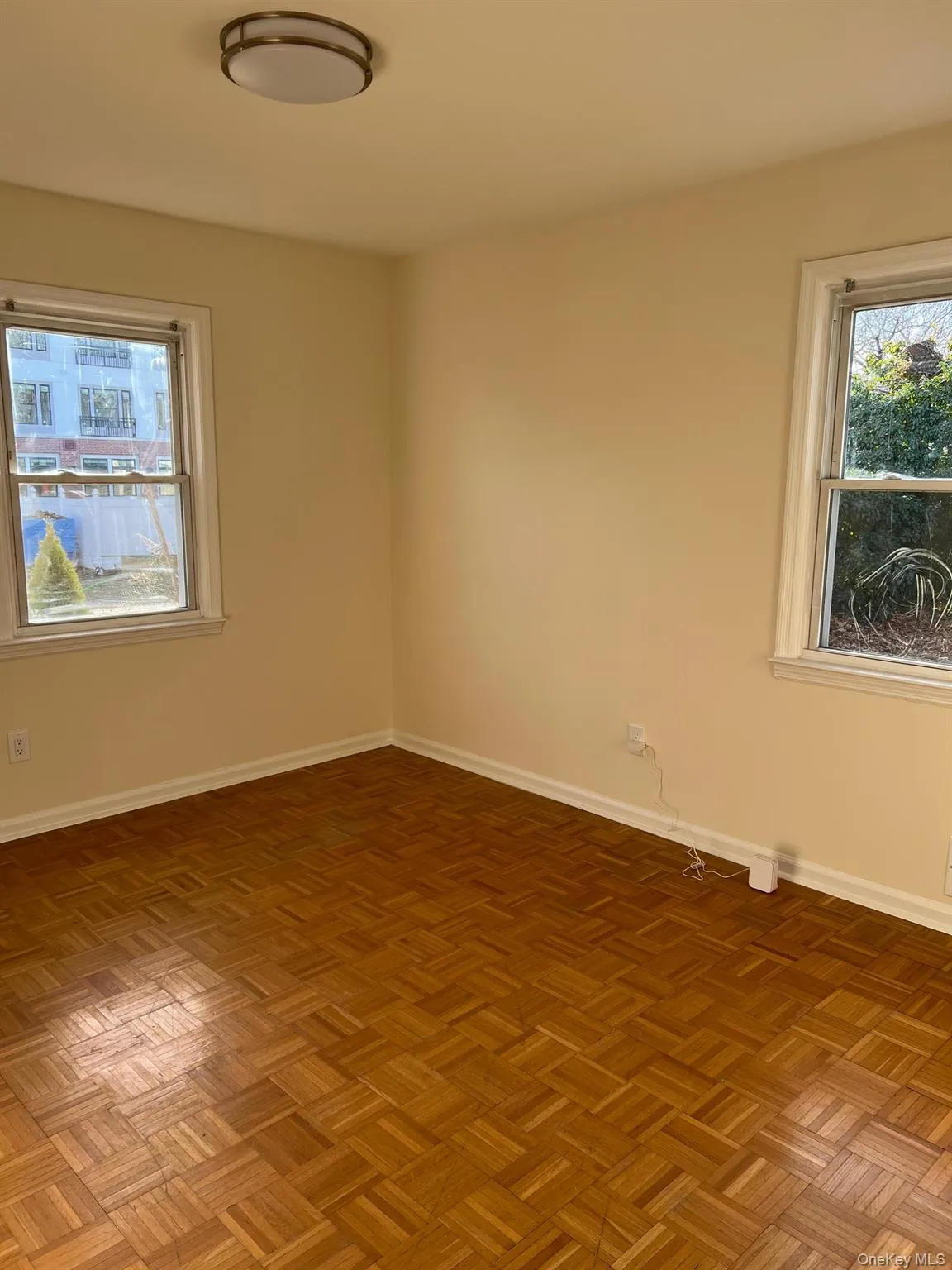 Unfurnished room with baseboards Unfurnished room with baseboards