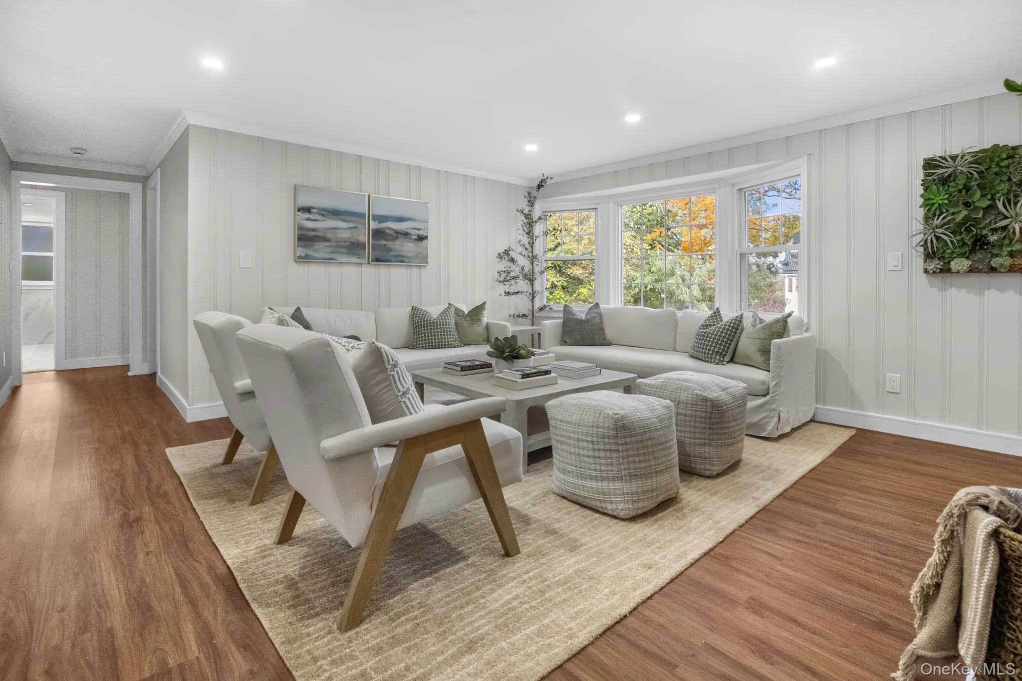 Open and welcoming living area with refinished floors and a seamless flow that’s perfect for gatherings or quiet evenings at home. Open and welcoming living area with refinished floors and a seamless flow that’s perfect for gatherings or quiet evenings at home.