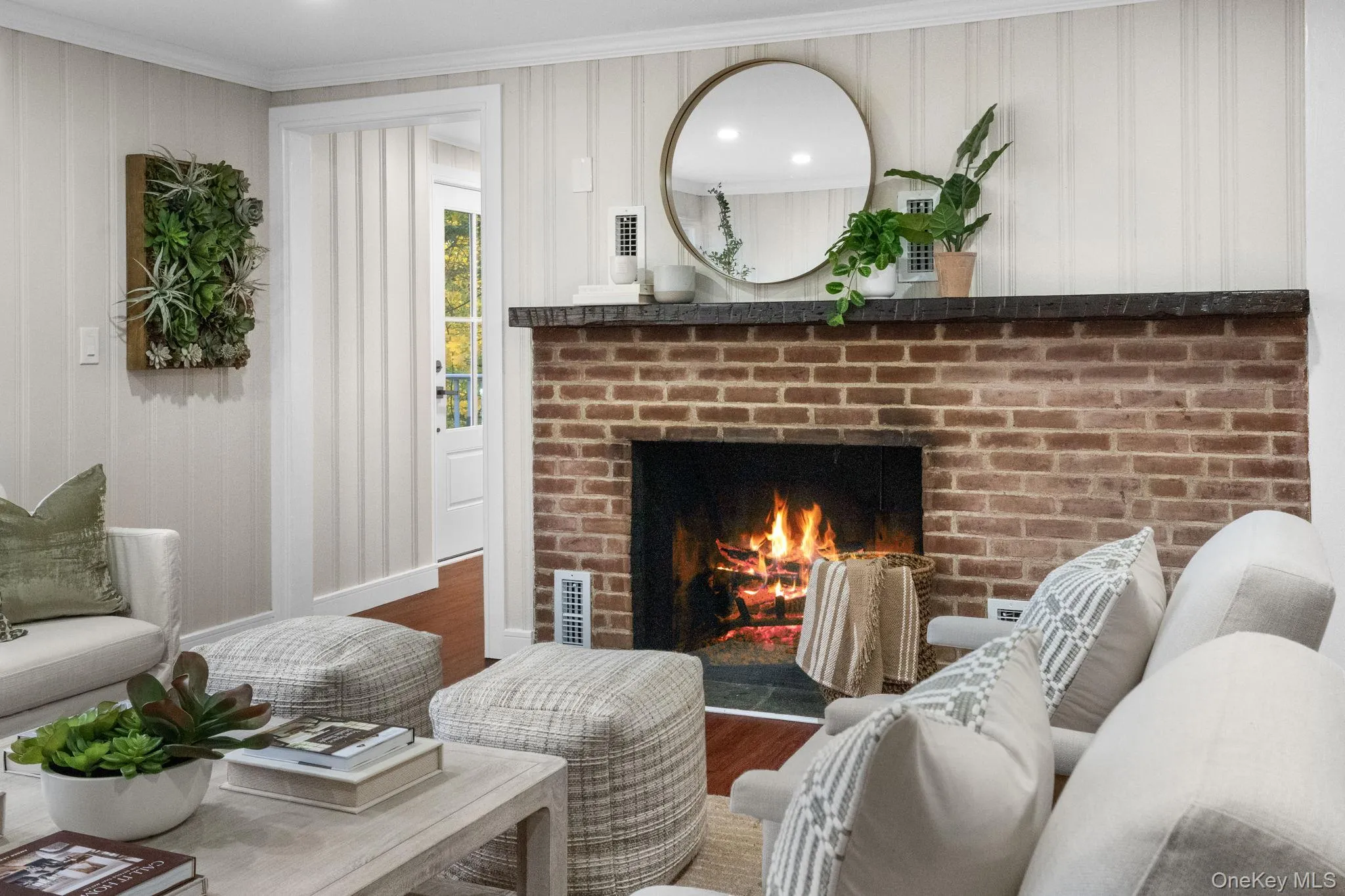 A classic brick hearth adds warmth and timeless character to this newly renovated gathering space. A classic brick hearth adds warmth and timeless character to this newly renovated gathering space.
