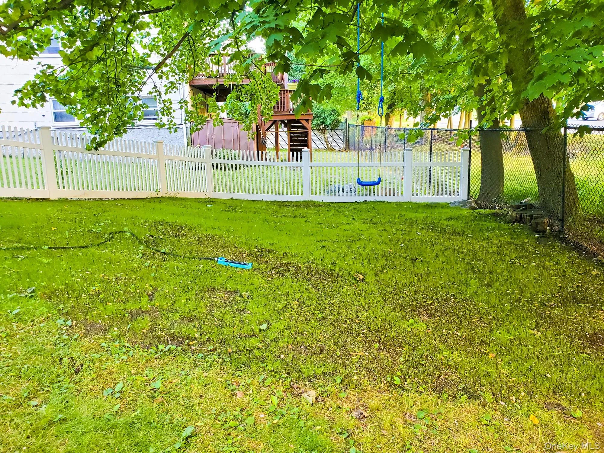 Fenced yard featuring stairway Fenced yard featuring stairway