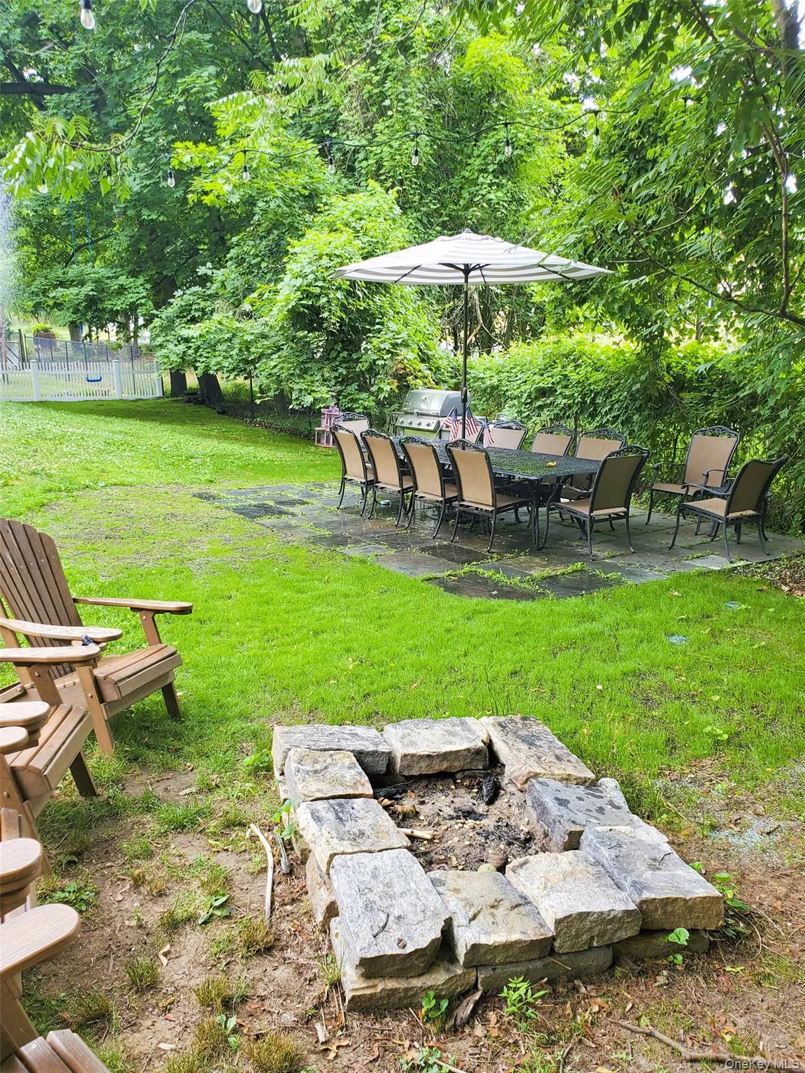 View of yard with a patio area and a fire pit View of yard with a patio area and a fire pit