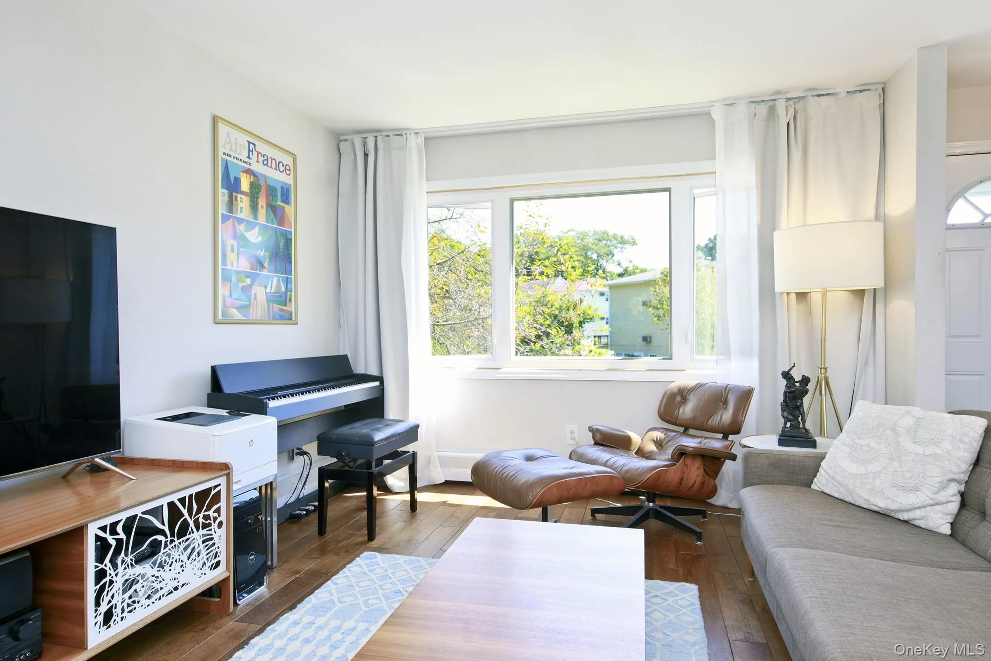 Living area with hardwood / wood-style floors Living area with hardwood / wood-style floors