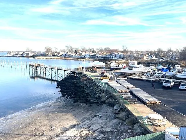 Dock featuring a water view and a boat ramp Dock featuring a water view and a boat ramp
